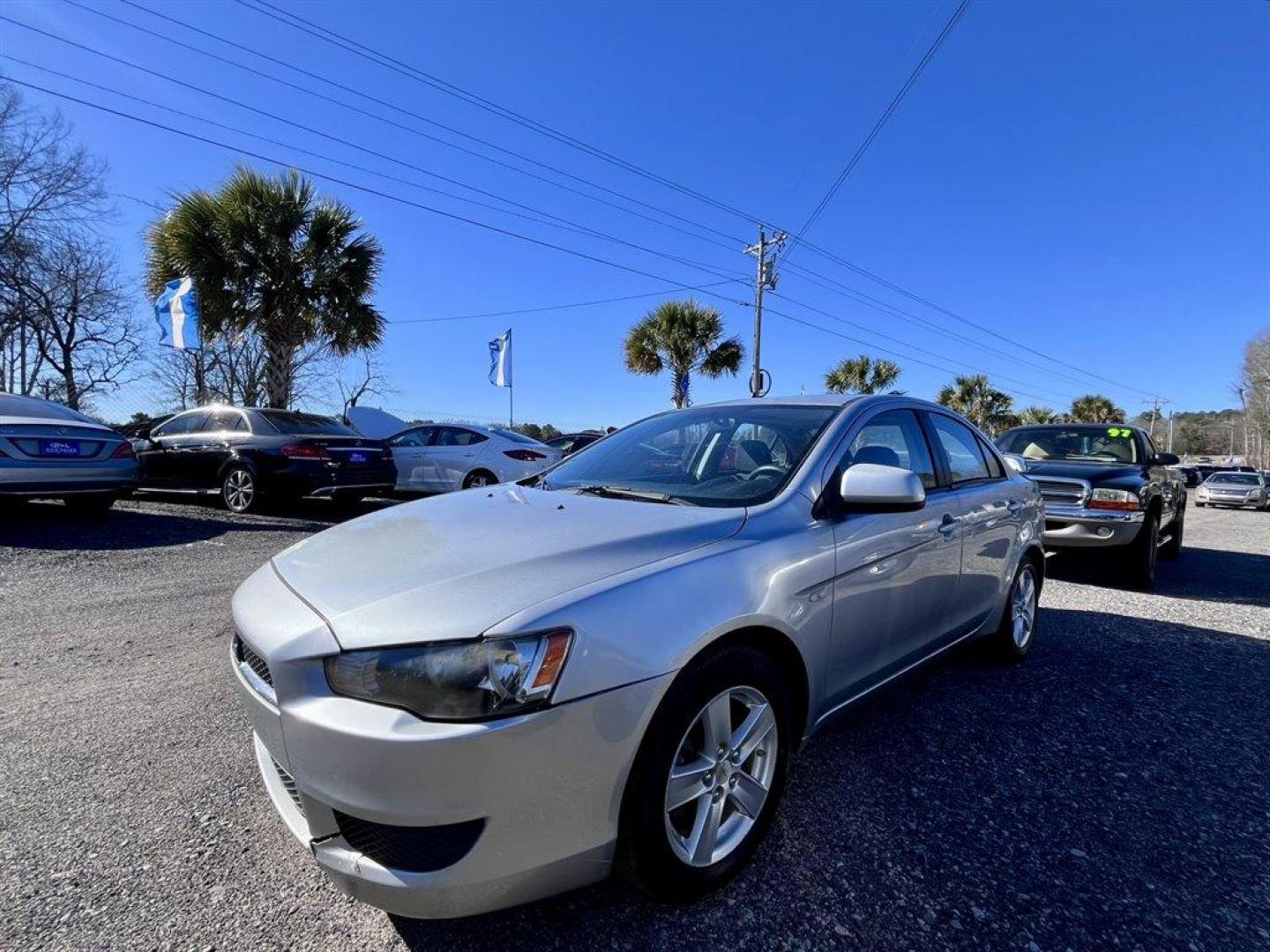 2008 Silver /Grey Mitsubishi Lancer (JA3AU26U08U) with an 2.0l I-4 MPI Dohc 2.0l engine, 5 Speed Manual transmission, located at 745 East Steele Rd., West Columbia, SC, 29170, (803) 755-9148, 33.927212, -81.148483 - Special Internet Price! 2008 Mitsubishi Lancer with AM/FM stereo, Manual transmission, Sunroof, Navigation, Backup camera, Air conditioning, Cloth interior, Powered windows, Powered door locks, Plus more! - Photo#0