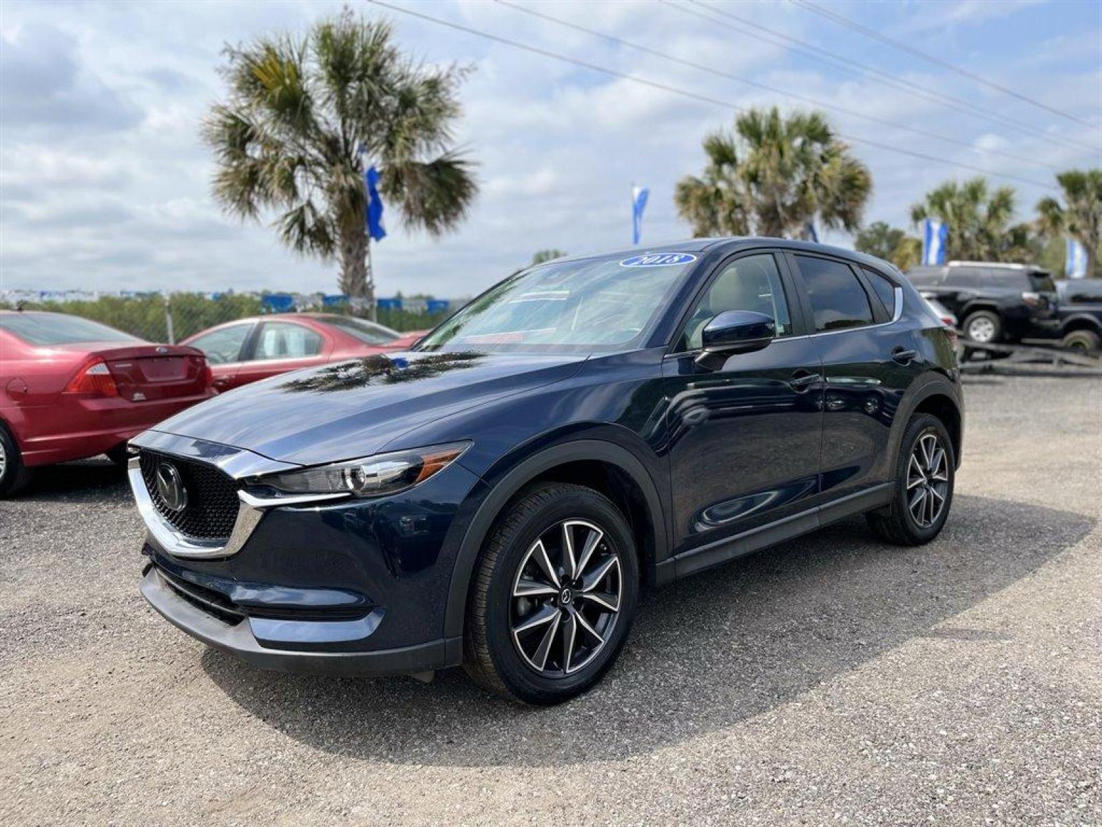 2018 Blue /Tan Mazda CX-5 Touring (JM3KFACM7J0) with an 2.5l I-4 DI Dohc 2.5l engine, Automatic transmission, located at 745 East Steele Rd., West Columbia, SC, 29170, (803) 755-9148, 33.927212, -81.148483 - Special Internet Price! 2018 Mazda CX-5 With Bluetooth, Backup Camera, Navigation, Leather Interior, Sunroof, AM/FM/HD Audio System -inc: 7 full-color touch-screen display, 6-speakers, Remote Keyless Entry,Blind Spot Monitoring, Collision Mitigation-Front, Plus More! - Photo #1
