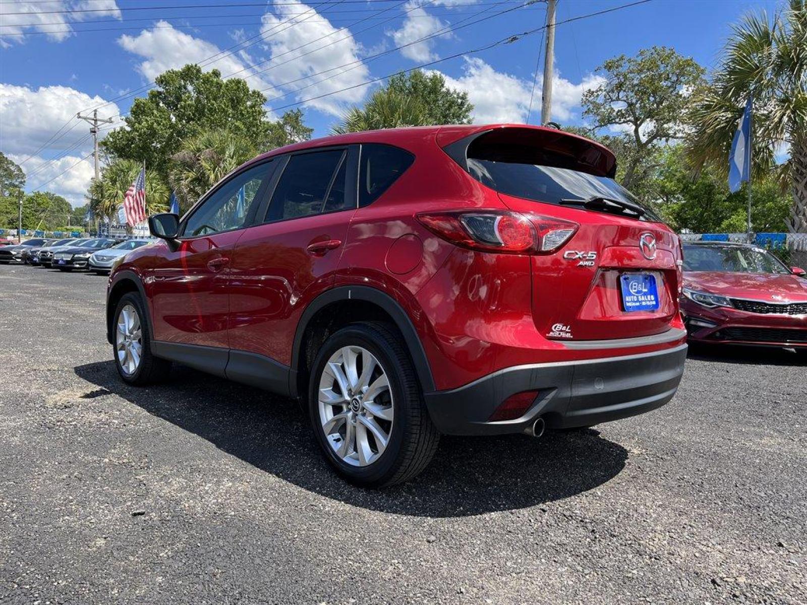 2015 Red /Black Mazda CX-5 (JM3KE4DY7F0) with an 2.5l I-4 DI Dohc 2.5l engine, Automatic transmission, located at 745 East Steele Rd., West Columbia, SC, 29170, (803) 755-9148, 33.927212, -81.148483 - Special Internet Price 2015 Mazda CX-5 has Sunroof, Bluetooth and Back Up Camera - Photo #1