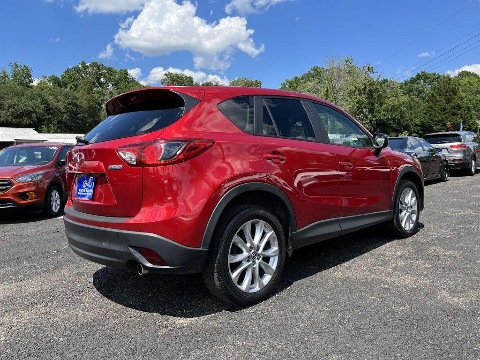 2015 Red /Black Mazda CX-5 (JM3KE4DY7F0) with an 2.5l I-4 DI Dohc 2.5l engine, Automatic transmission, located at 745 East Steele Rd., West Columbia, SC, 29170, (803) 755-9148, 33.927212, -81.148483 - Special Internet Price 2015 Mazda CX-5 has Sunroof, Bluetooth and Back Up Camera - Photo #2