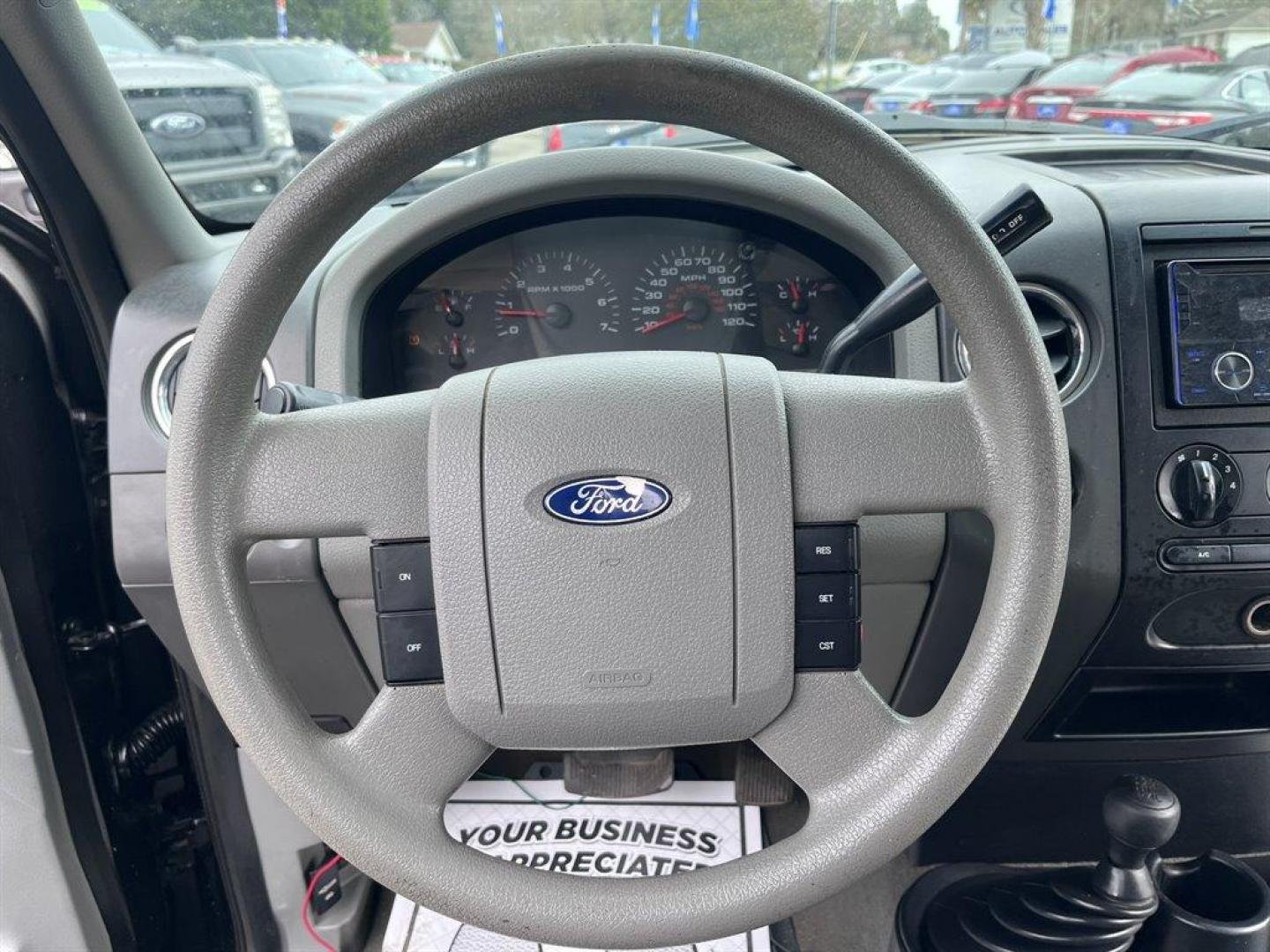 2007 Black /Grey Ford F150 (1FTRX14W47N) with an 4.6l V8 EFI Sohc 4.6l engine, Automatic transmission, located at 745 East Steele Rd., West Columbia, SC, 29170, (803) 755-9148, 33.927212, -81.148483 - Special Internet Price! 2007 Ford F-150 XLT with AM/FM stereo w/CD player, Cruise control, Remote keyless entry, Premium cloth 40/20/40 split bench front seat, Powered windows, Powered door locks, Plus more! - Photo#5