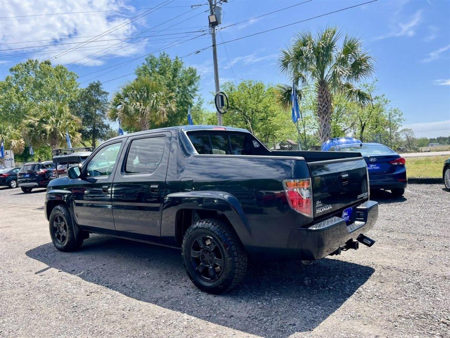 2007 Black /Grey Honda Ridgeline (2HJYK16567H) with an 3.5l V6 MPI Sohc Vtec 3.5 engine, Automatic transmission, located at 745 East Steele Rd., West Columbia, SC, 29170, (803) 755-9148, 33.927212, -81.148483 - Special Internet Price! 2007 Honda Ridgeline RTL with AM/FM radio, Remote keyless entry, Cruise control, Dual-zone automatic climate control, Leather interior, 60/40 split fold rear seat, Powered windows, Powered door locks, Plus more! - Photo#1