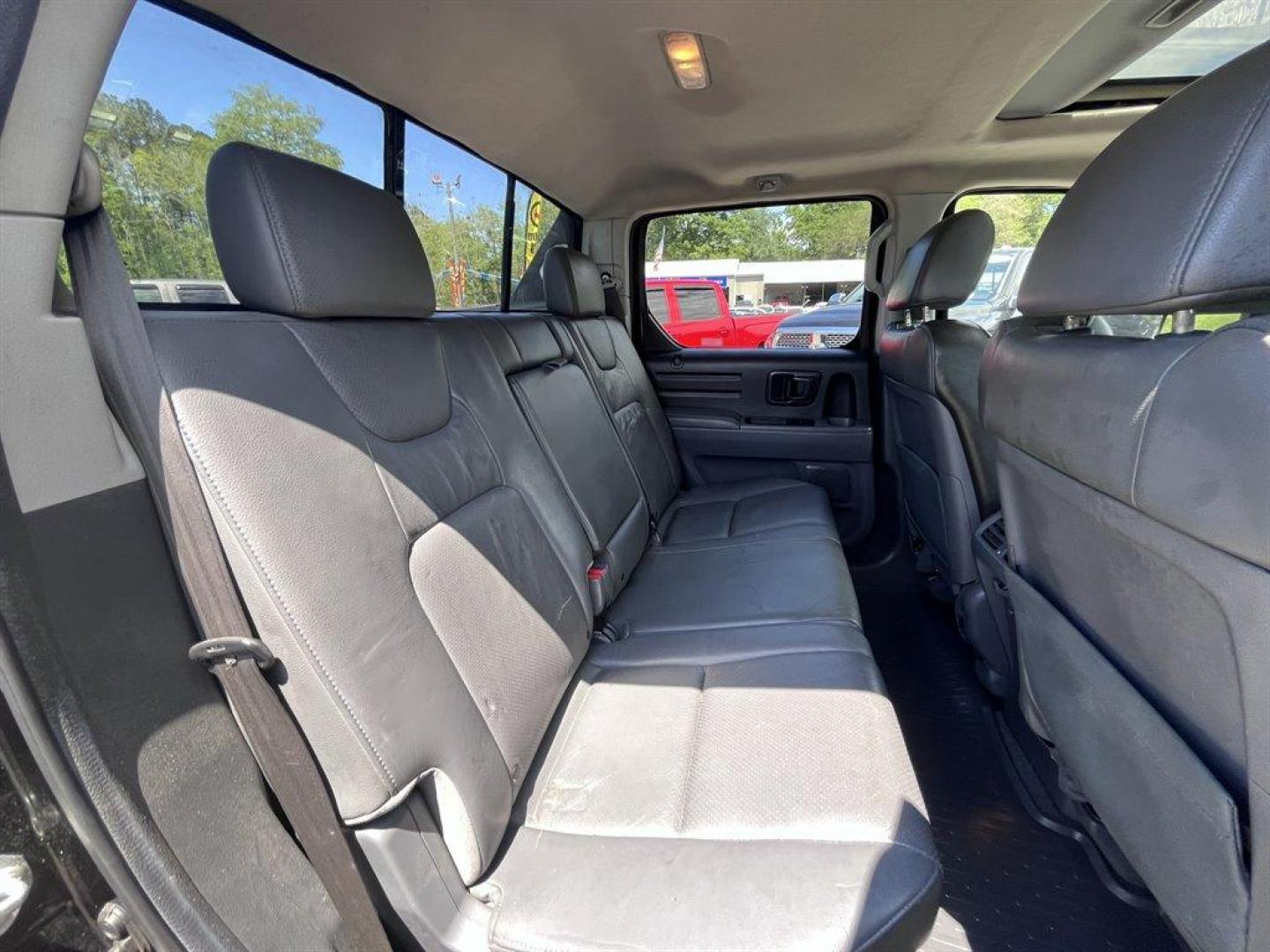 2007 Black /Grey Honda Ridgeline (2HJYK16567H) with an 3.5l V6 MPI Sohc Vtec 3.5 engine, Automatic transmission, located at 745 East Steele Rd., West Columbia, SC, 29170, (803) 755-9148, 33.927212, -81.148483 - Special Internet Price! 2007 Honda Ridgeline RTL with AM/FM radio, Remote keyless entry, Cruise control, Dual-zone automatic climate control, Leather interior, 60/40 split fold rear seat, Powered windows, Powered door locks, Plus more! - Photo#23