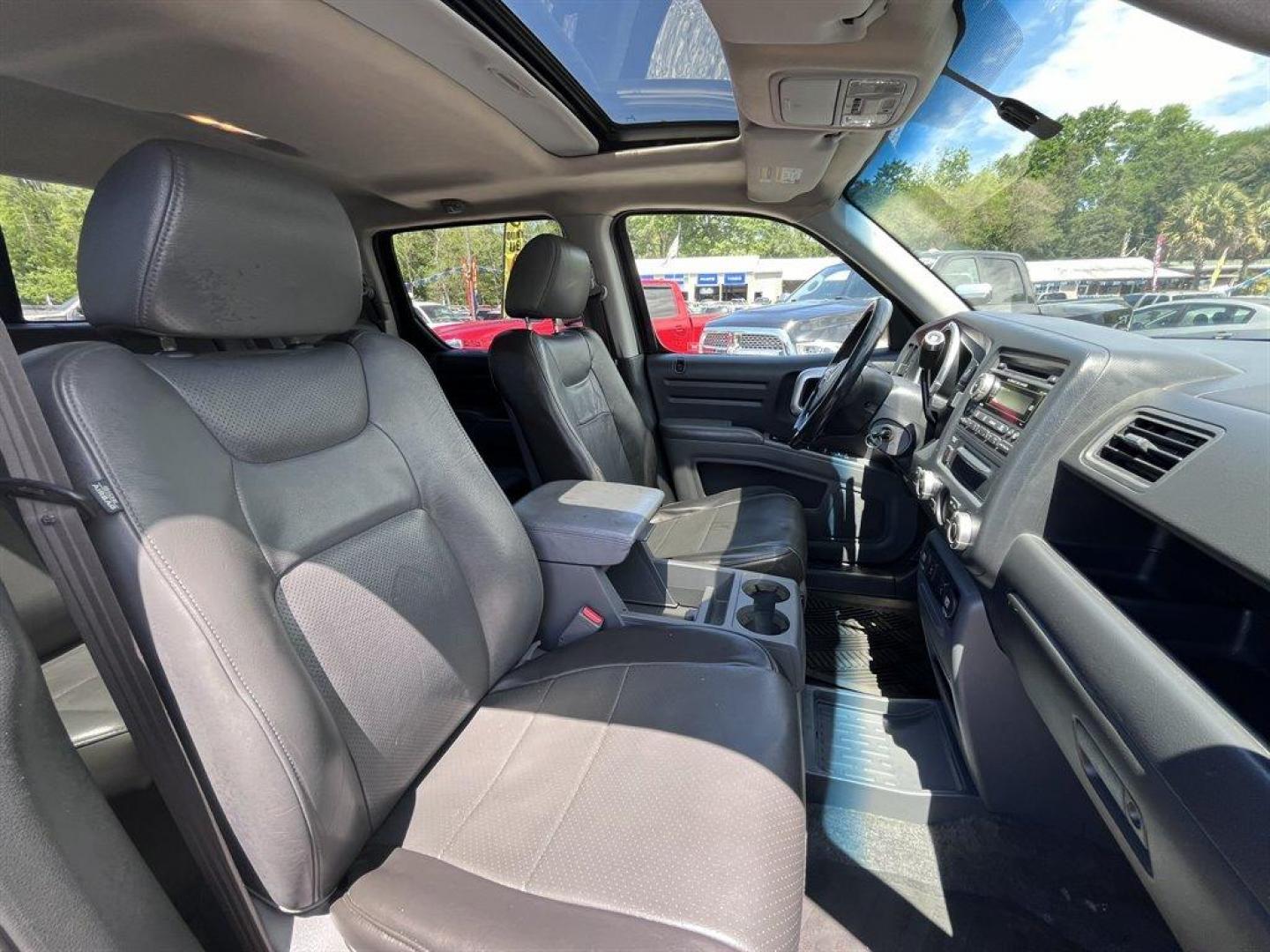 2007 Black /Grey Honda Ridgeline (2HJYK16567H) with an 3.5l V6 MPI Sohc Vtec 3.5 engine, Automatic transmission, located at 745 East Steele Rd., West Columbia, SC, 29170, (803) 755-9148, 33.927212, -81.148483 - Special Internet Price! 2007 Honda Ridgeline RTL with AM/FM radio, Remote keyless entry, Cruise control, Dual-zone automatic climate control, Leather interior, 60/40 split fold rear seat, Powered windows, Powered door locks, Plus more! - Photo#25