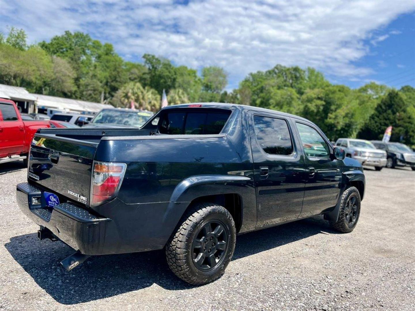 2007 Black /Grey Honda Ridgeline (2HJYK16567H) with an 3.5l V6 MPI Sohc Vtec 3.5 engine, Automatic transmission, located at 745 East Steele Rd., West Columbia, SC, 29170, (803) 755-9148, 33.927212, -81.148483 - Special Internet Price! 2007 Honda Ridgeline RTL with AM/FM radio, Remote keyless entry, Cruise control, Dual-zone automatic climate control, Leather interior, 60/40 split fold rear seat, Powered windows, Powered door locks, Plus more! - Photo#2