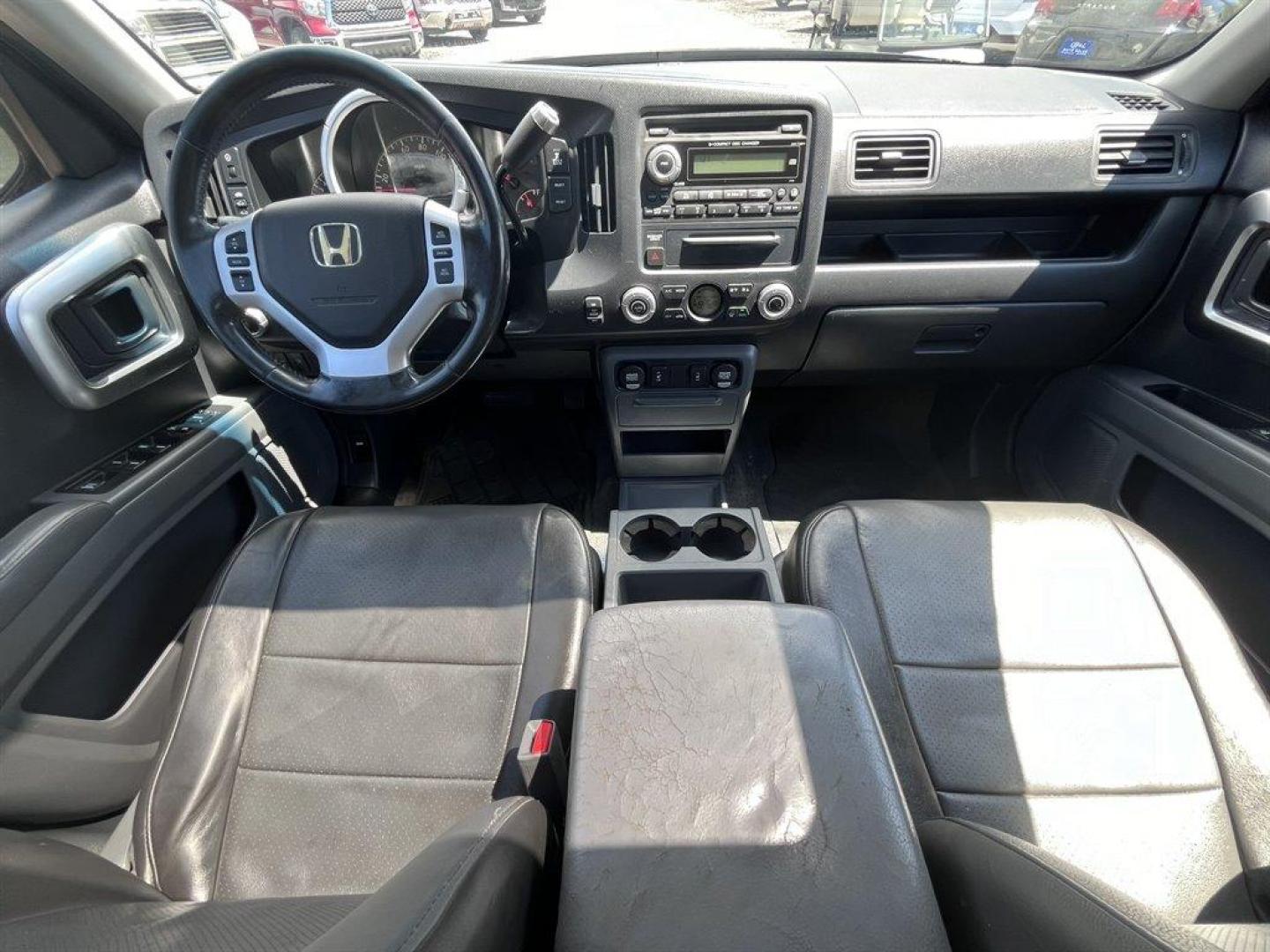 2007 Black /Grey Honda Ridgeline (2HJYK16567H) with an 3.5l V6 MPI Sohc Vtec 3.5 engine, Automatic transmission, located at 745 East Steele Rd., West Columbia, SC, 29170, (803) 755-9148, 33.927212, -81.148483 - Special Internet Price! 2007 Honda Ridgeline RTL with AM/FM radio, Remote keyless entry, Cruise control, Dual-zone automatic climate control, Leather interior, 60/40 split fold rear seat, Powered windows, Powered door locks, Plus more! - Photo#4