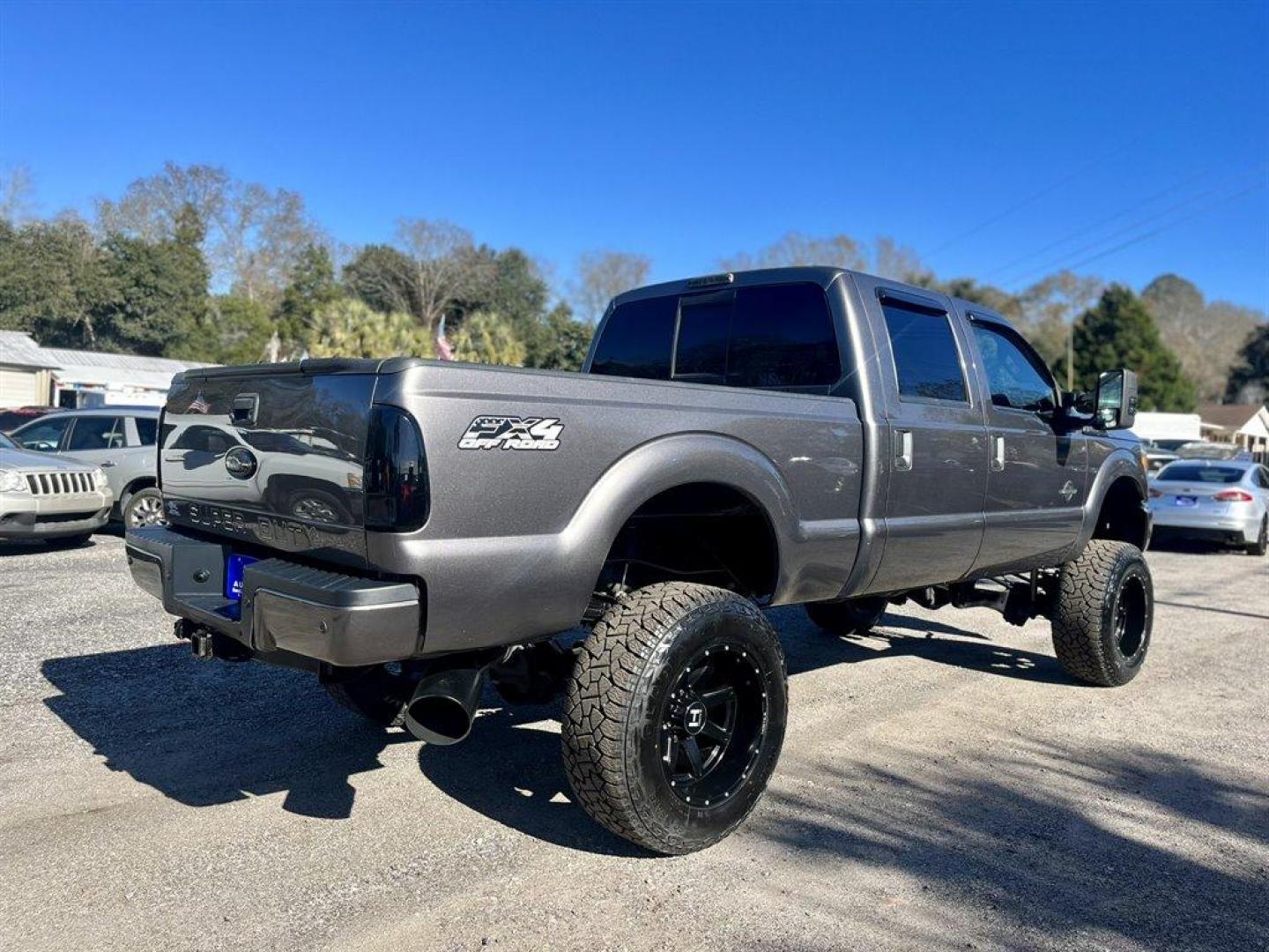 2012 Grey /Black Ford F250sd (1FT7W2BTXCE) with an 6.7l V8 DI OHC Tdsl 6.7l engine, Automatic transmission, located at 745 East Steele Rd., West Columbia, SC, 29170, (803) 755-9148, 33.927212, -81.148483 - Special Internet Price! 2012 Ford F250SD with Bluetooth, AM/FM stereo radio, Backup Camera, Sunroof, Air conditioning, Keyless entry, Powered running boards, Leather interior, Tailgate step, Powered driver seat, Powered windows, Powered door locks, Plus more! - Photo#2