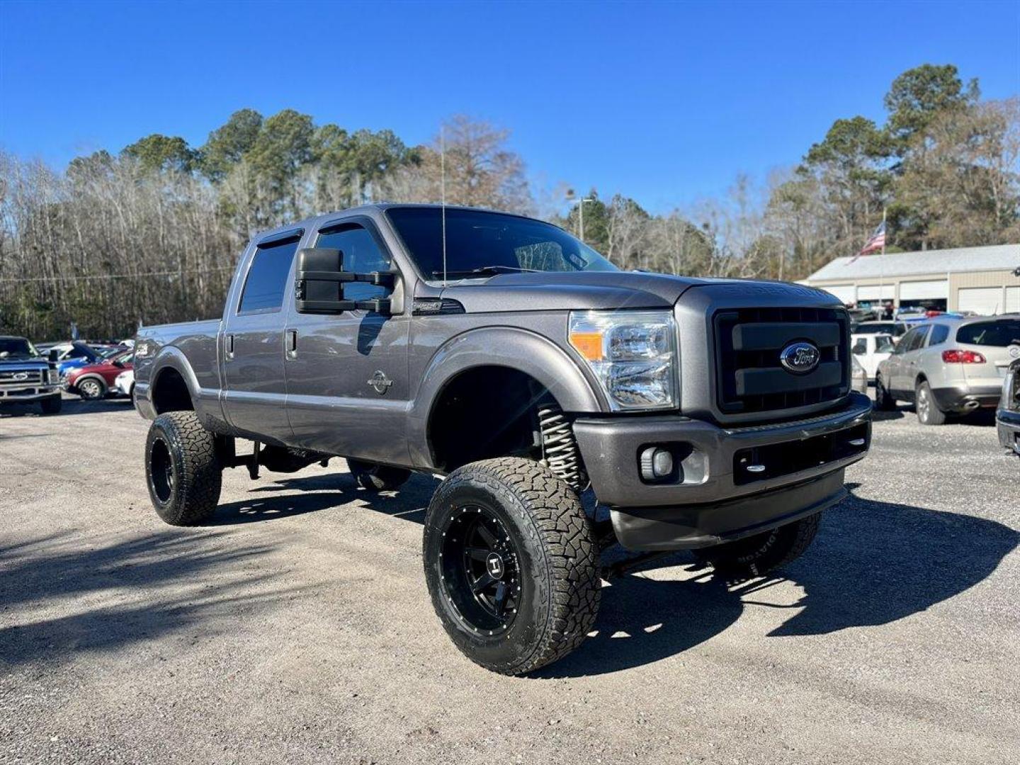 2012 Grey /Black Ford F250sd (1FT7W2BTXCE) with an 6.7l V8 DI OHC Tdsl 6.7l engine, Automatic transmission, located at 745 East Steele Rd., West Columbia, SC, 29170, (803) 755-9148, 33.927212, -81.148483 - Special Internet Price! 2012 Ford F250SD with Bluetooth, AM/FM stereo radio, Backup Camera, Sunroof, Air conditioning, Keyless entry, Powered running boards, Leather interior, Tailgate step, Powered driver seat, Powered windows, Powered door locks, Plus more! - Photo#3