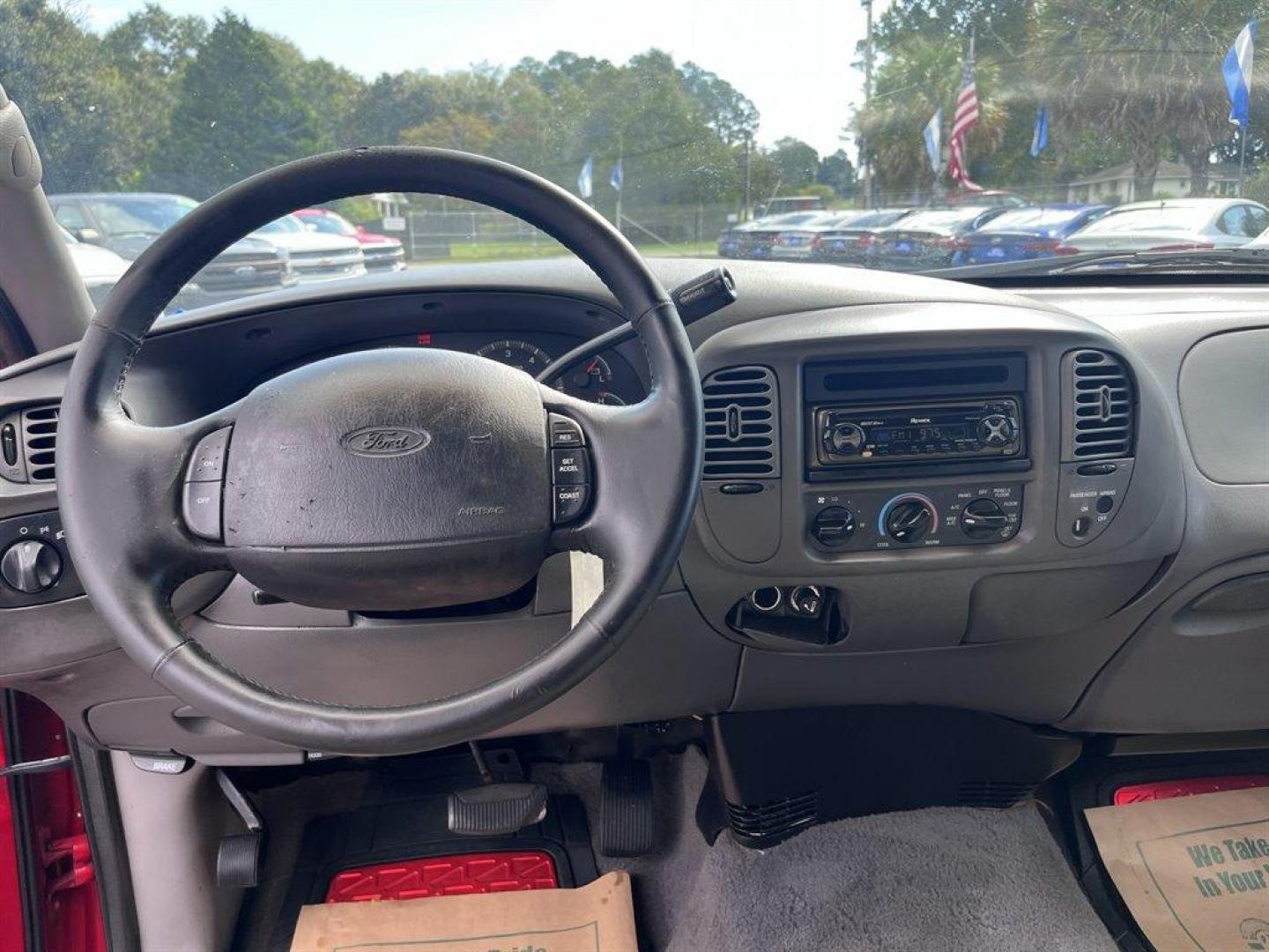 2000 Red /Grey Ford F150 (1FTRX17W0YN) with an 4.6l V8 EFI Sohc 4.6l engine, Automatic transmission, located at 745 East Steele Rd., West Columbia, SC, 29170, (803) 755-9148, 33.927212, -81.148483 - Special Internet Price! 2000 Ford F150 XLT with Electronic AM/FM stereo radio, Cruise control, Cloth interior, Powered door locks, Powered windows, Seats up to 6, Truck bed cap, Plus more! - Photo#4