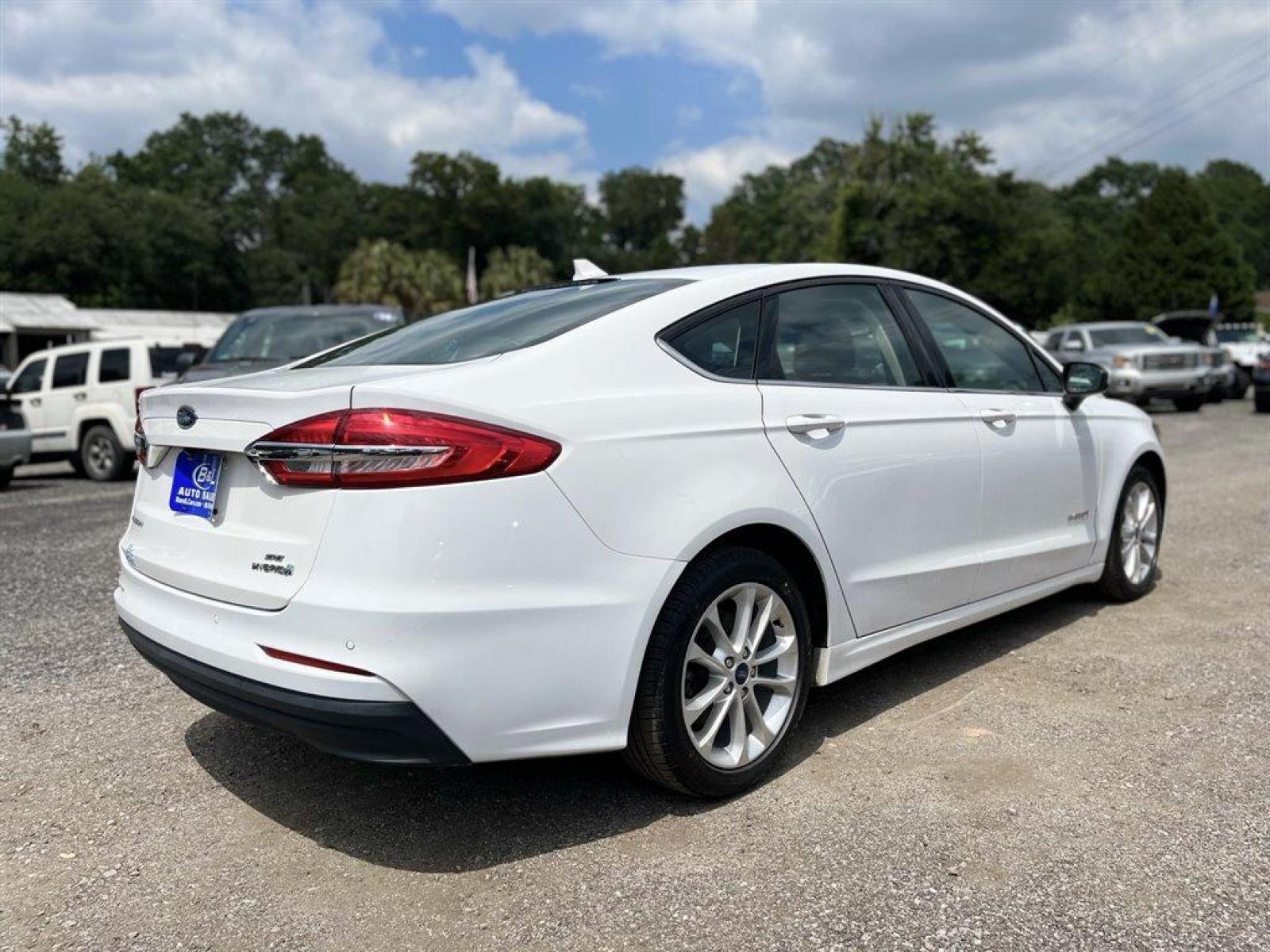 2019 White /Black Ford Fusion SE (3FA6P0LU3KR) with an 2.0l I-4 Smpi Dohc Hybrid engine, Automatic transmission, located at 745 East Steele Rd., West Columbia, SC, 29170, (803) 755-9148, 33.927212, -81.148483 - Special Internet Price! 2019 Ford Fusion SE Hybrid with Bluetooth, Backup Camera, Navigation,Radio w/Seek-Scan, Cruise Control, Cloth Front Bucket Seats, Integrated Navigation System, Remote Keyless Entry, Hybrid Electric Motor, Rear Parking Sensors, Collision Mitigation-Front, Driver Monitoring-Ale - Photo #2