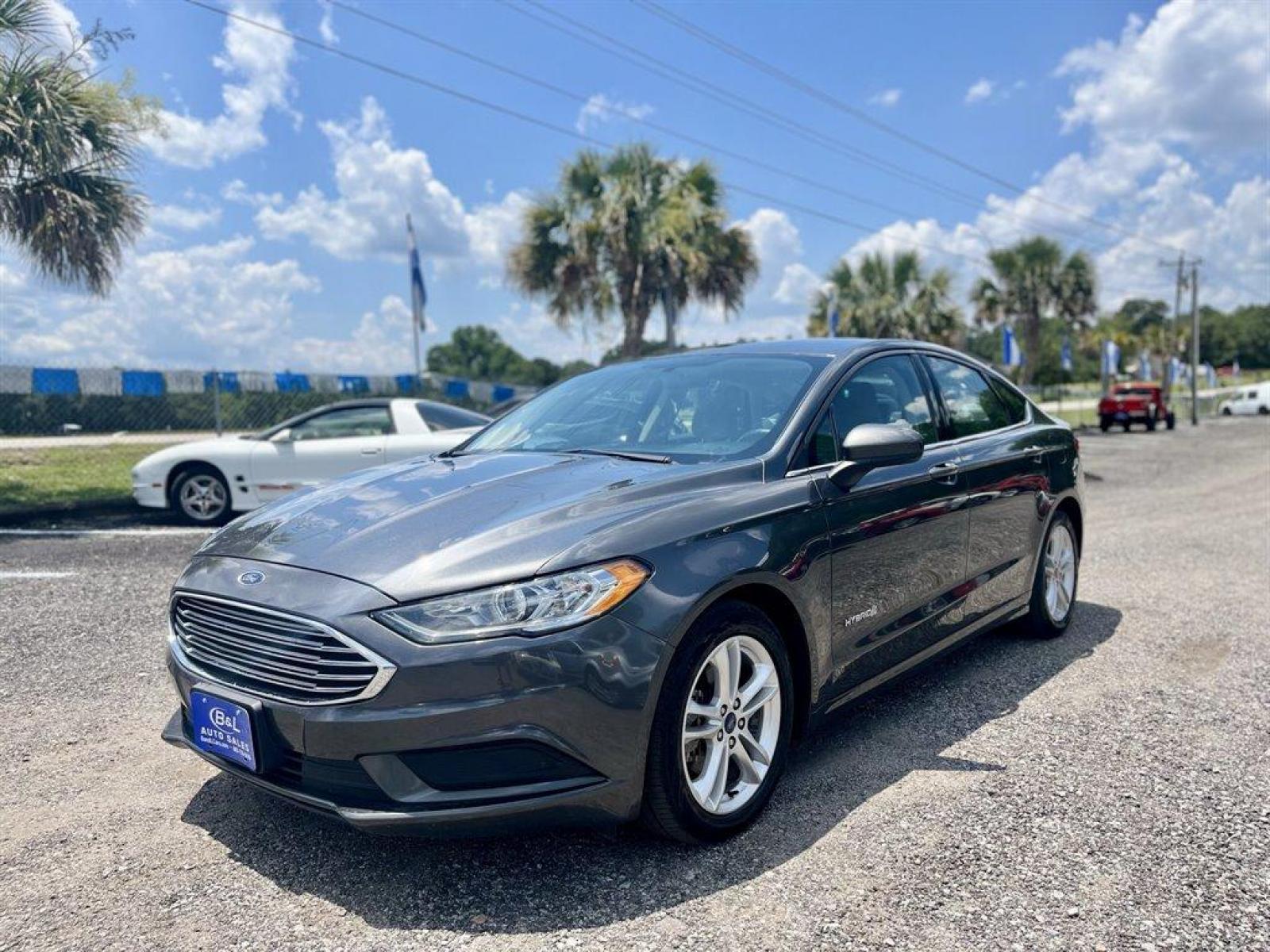 2018 Grey /Grey Ford Fusion (3FA6P0UU5JR) with an 2.0l I-4 Smpi Dohc Hybrid engine, Automatic transmission, located at 745 East Steele Rd., West Columbia, SC, 29170, (803) 755-9148, 33.927212, -81.148483 - Special Internet Price! 2018 FORD FUSION S HYBRID with Radio w/Seek-Scan, Bluetooth, Cruise Control, Backup Camera, 4.2 LCD screen, Remote Keyless Entry, Push to Start, Cloth Interior, 60-40 Folding Bench Rear Seats, Plus More! - Photo #0
