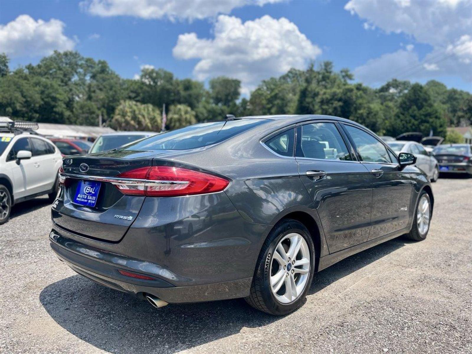 2018 Grey /Grey Ford Fusion (3FA6P0UU5JR) with an 2.0l I-4 Smpi Dohc Hybrid engine, Automatic transmission, located at 745 East Steele Rd., West Columbia, SC, 29170, (803) 755-9148, 33.927212, -81.148483 - Special Internet Price! 2018 FORD FUSION S HYBRID with Radio w/Seek-Scan, Bluetooth, Cruise Control, Backup Camera, 4.2 LCD screen, Remote Keyless Entry, Push to Start, Cloth Interior, 60-40 Folding Bench Rear Seats, Plus More! - Photo #2