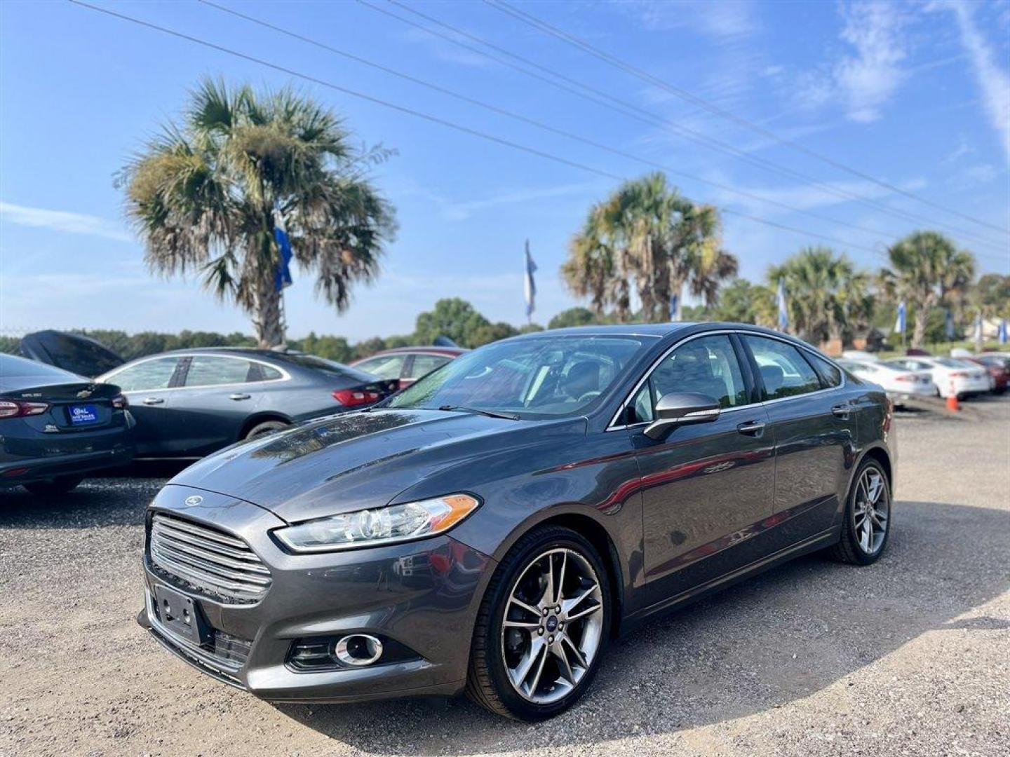 2015 Grey /Black Ford Fusion (3FA6P0K9XFR) with an 2.0l I-4 DI T/C Ecoboost engine, Automatic transmission, located at 745 East Steele Rd., West Columbia, SC, 29170, (803) 755-9148, 33.927212, -81.148483 - Special Internet Price! 2015 Ford Fusion Titanium with Bluetooth, Backup camera, Navigation, Sunroof, SIRIUS Satellite Radio, Remote Keyless Entry, Leather Interior, Rear 60-40 Folding Bench, Cruise Control with Steering Wheel Controls, Plus more! - Photo#0