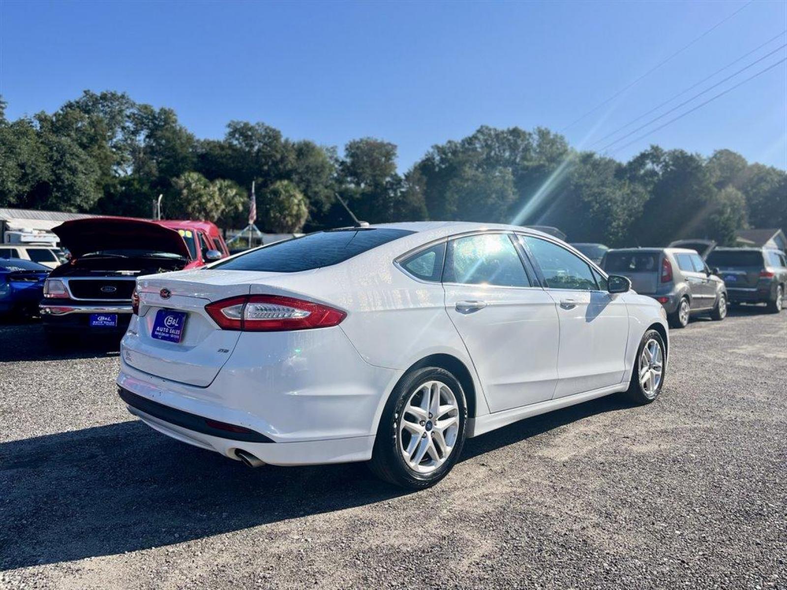 2015 White /Black Ford Fusion (3FA6P0H79FR) with an 2.5l I-4 Smpi Dohc 2.5l engine, Automatic transmission, located at 745 East Steele Rd., West Columbia, SC, 29170, (803) 755-9148, 33.927212, -81.148483 - Special Interent Price! 2015 Ford Fusion with AM/FM Stereo/MP3/Single-CD, Bluetooth, Manual Air Conditioning, Cruise Control, Remote Keyless Entry, Cloth interior, Rear 60-40 Folding Bench, Front powered seats, Plus more! - Photo #2