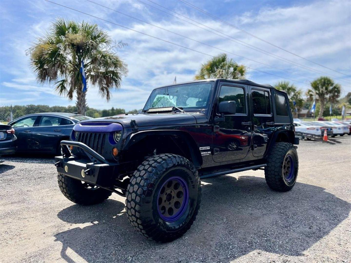 2013 Black /Black Jeep Wrangler (1C4BJWDG8DL) with an 3.6l V6 MPI Dohc 3.6l engine, Automatic transmission, located at 745 East Steele Rd., West Columbia, SC, 29170, (803) 755-9148, 33.927212, -81.148483 - Special Internet Price! 2013 Jeep Wrangler Unlimited Sport with AM/FM stereo, Bluetooth, Backup camera, Steering wheel mounted audio controls, Air conditioning, Sport bar with full padding, Light bar, Locking glove box, Plus more! - Photo#0