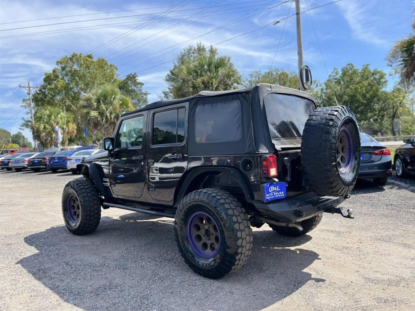 2013 Black /Black Jeep Wrangler (1C4BJWDG8DL) with an 3.6l V6 MPI Dohc 3.6l engine, Automatic transmission, located at 745 East Steele Rd., West Columbia, SC, 29170, (803) 755-9148, 33.927212, -81.148483 - Special Internet Price! 2013 Jeep Wrangler Unlimited Sport with AM/FM stereo, Bluetooth, Backup camera, Steering wheel mounted audio controls, Air conditioning, Sport bar with full padding, Light bar, Locking glove box, Plus more! - Photo#1