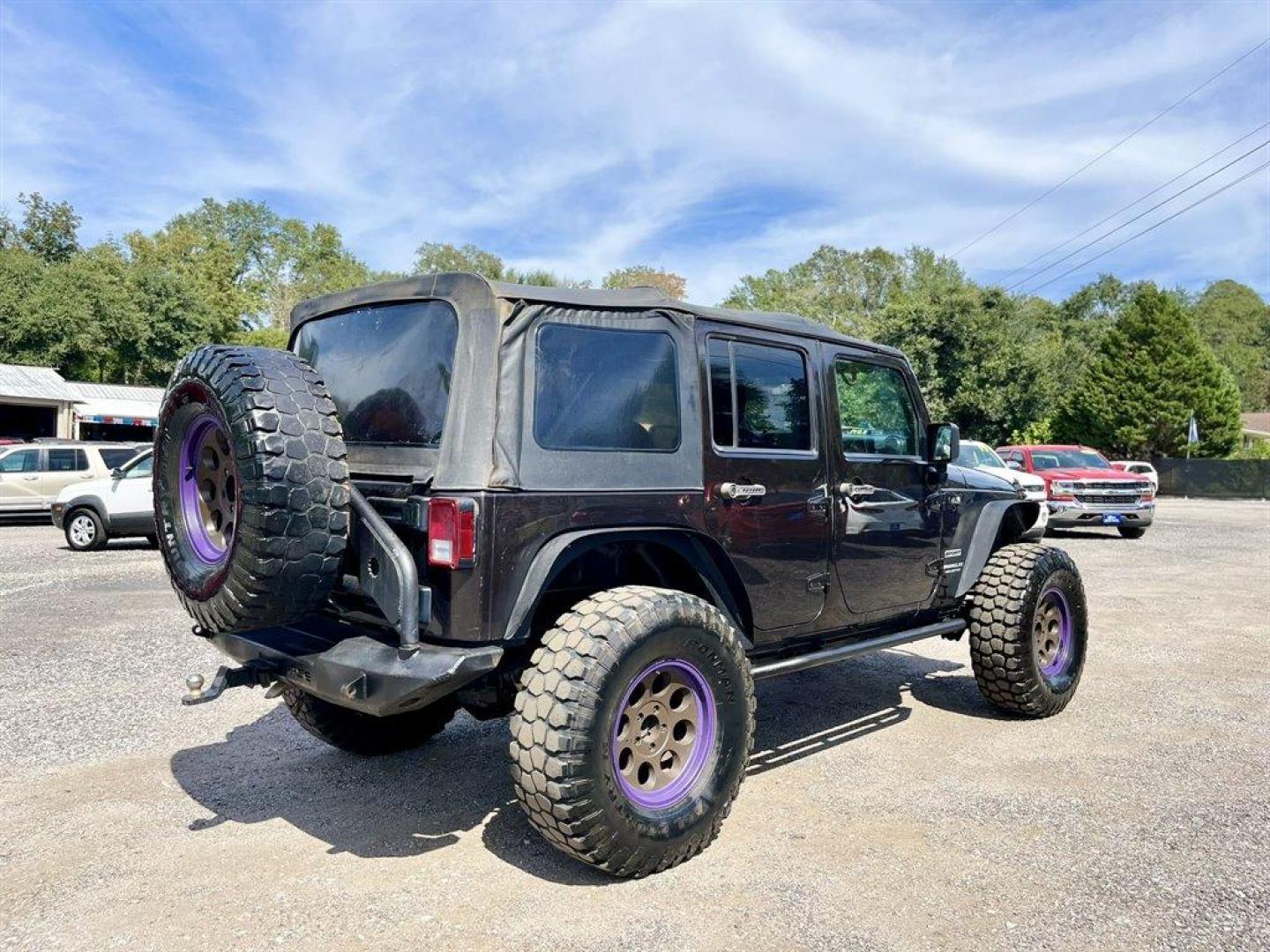 2013 Black /Black Jeep Wrangler (1C4BJWDG8DL) with an 3.6l V6 MPI Dohc 3.6l engine, Automatic transmission, located at 745 East Steele Rd., West Columbia, SC, 29170, (803) 755-9148, 33.927212, -81.148483 - Special Internet Price! 2013 Jeep Wrangler Unlimited Sport with AM/FM stereo, Bluetooth, Backup camera, Steering wheel mounted audio controls, Air conditioning, Sport bar with full padding, Light bar, Locking glove box, Plus more! - Photo#2