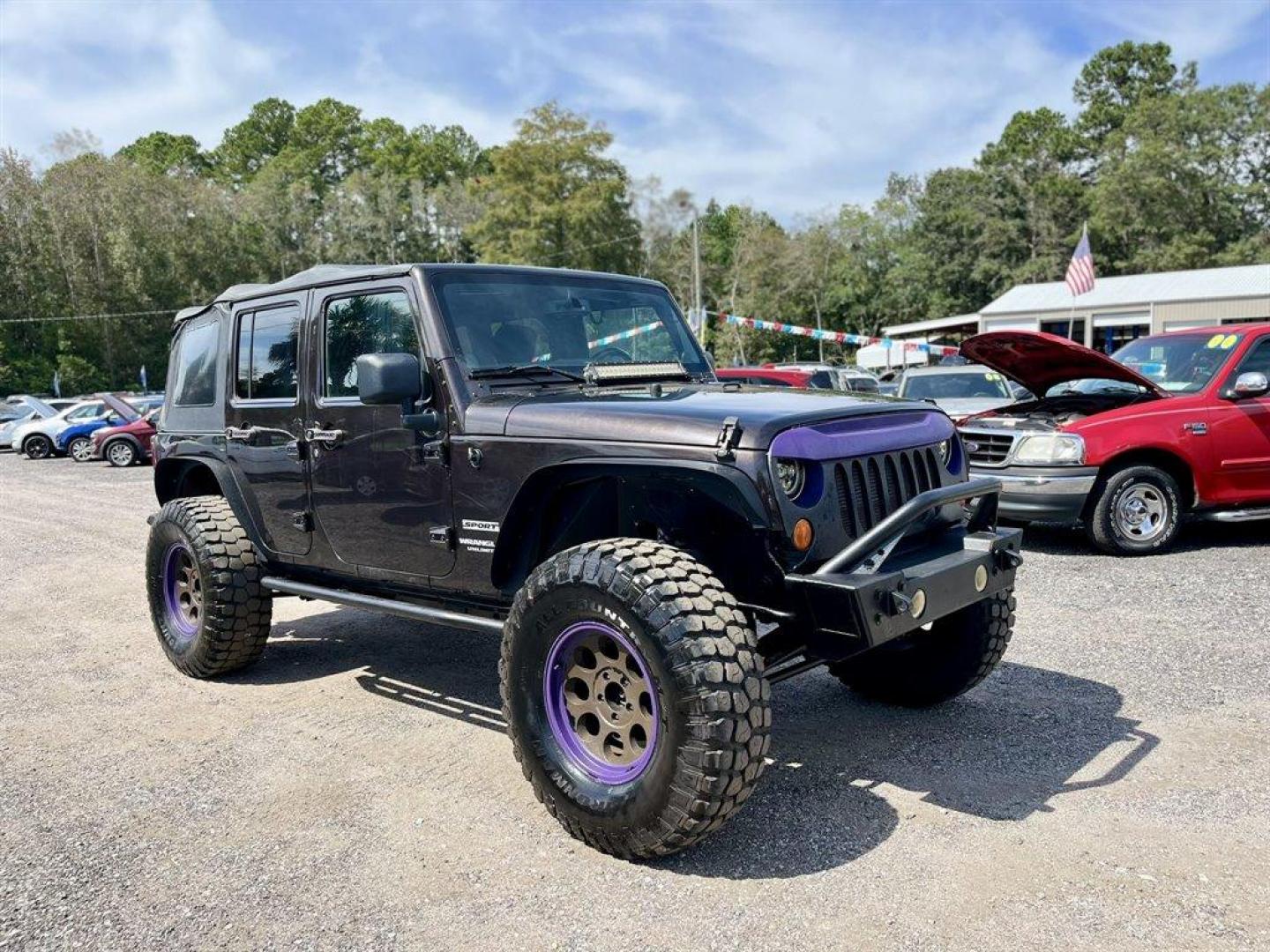 2013 Black /Black Jeep Wrangler (1C4BJWDG8DL) with an 3.6l V6 MPI Dohc 3.6l engine, Automatic transmission, located at 745 East Steele Rd., West Columbia, SC, 29170, (803) 755-9148, 33.927212, -81.148483 - Special Internet Price! 2013 Jeep Wrangler Unlimited Sport with AM/FM stereo, Bluetooth, Backup camera, Steering wheel mounted audio controls, Air conditioning, Sport bar with full padding, Light bar, Locking glove box, Plus more! - Photo#3