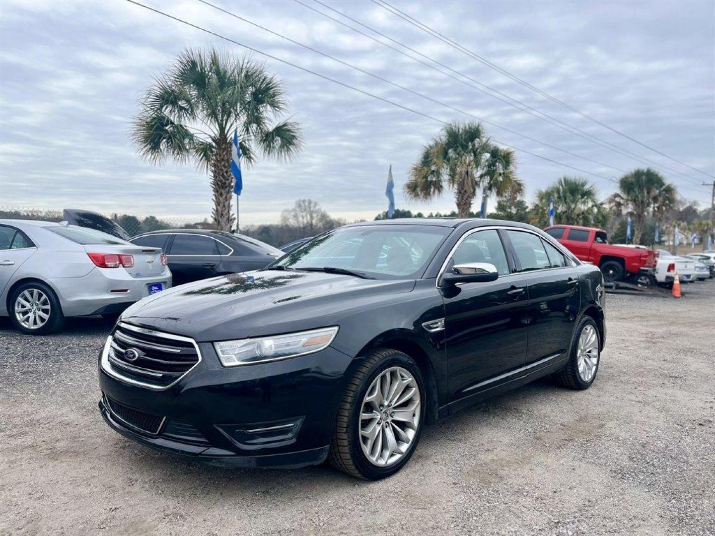 2013 Black /Black Ford Taurus (1FAHP2F80DG) with an 3.5l V6 Smpi TI-VCT 3.5l engine, Automatic transmission, located at 745 East Steele Rd., West Columbia, SC, 29170, (803) 755-9148, 33.927212, -81.148483 - Special Internet Price! 2013 Ford Taurus Limited with Bluetooth, AM/FM stereo, Cruise control, Backup camera, Remote keyless entry, Dual-zone air conditioning, Leather interior, Powered driver seat, Rear 60/40 split fold-flat, Powered windows, Powered door locks, Plus more! - Photo#0