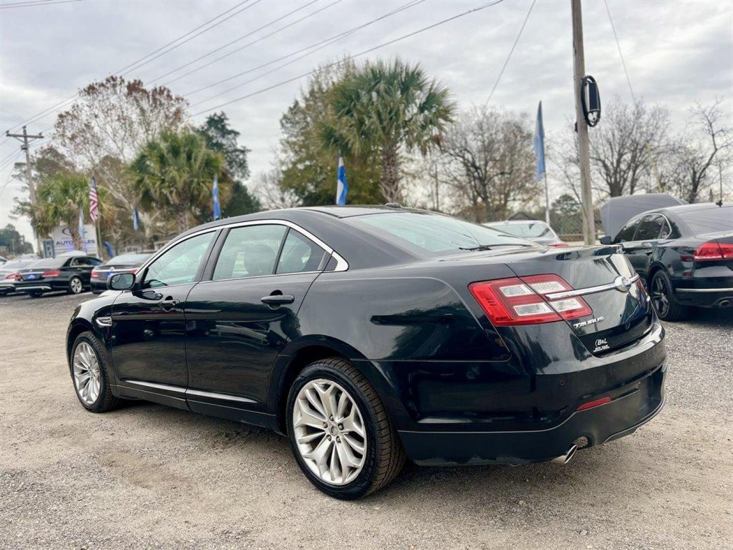 2013 Black /Black Ford Taurus (1FAHP2F80DG) with an 3.5l V6 Smpi TI-VCT 3.5l engine, Automatic transmission, located at 745 East Steele Rd., West Columbia, SC, 29170, (803) 755-9148, 33.927212, -81.148483 - Special Internet Price! 2013 Ford Taurus Limited with Bluetooth, AM/FM stereo, Cruise control, Backup camera, Remote keyless entry, Dual-zone air conditioning, Leather interior, Powered driver seat, Rear 60/40 split fold-flat, Powered windows, Powered door locks, Plus more! - Photo#1