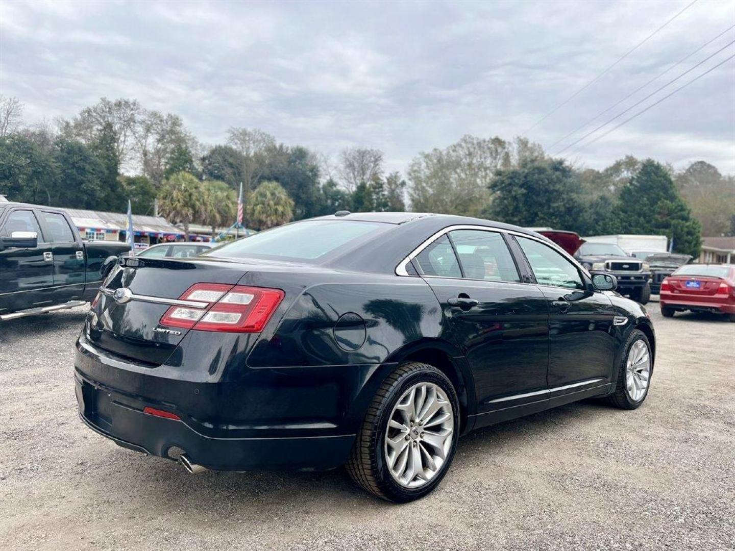 2013 Black /Black Ford Taurus (1FAHP2F80DG) with an 3.5l V6 Smpi TI-VCT 3.5l engine, Automatic transmission, located at 745 East Steele Rd., West Columbia, SC, 29170, (803) 755-9148, 33.927212, -81.148483 - Special Internet Price! 2013 Ford Taurus Limited with Bluetooth, AM/FM stereo, Cruise control, Backup camera, Remote keyless entry, Dual-zone air conditioning, Leather interior, Powered driver seat, Rear 60/40 split fold-flat, Powered windows, Powered door locks, Plus more! - Photo#2