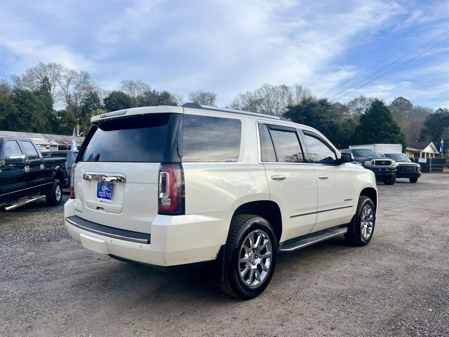 2015 White /Tan GMC Yukon (1GKS2CKJ1FR) with an 6.2l V8 DI OHV VVT S/C 6. engine, Automatic transmission, located at 745 East Steele Rd., West Columbia, SC, 29170, (803) 755-9148, 33.927212, -81.148483 - Special Internet Price! 2015 GMC Yukon Denali with Bluetooth, SiriusXM, 8 Diagonal Color Touch Screen, Backup Camera, Navigation, Cruise Control, Sunroof, Remote Keyless Entry, Rear Entertainment, Leather Interior, Powered Front Seats, Heated Front Seats, Power Fold 3rd Row Split Bench Seat, Powered - Photo#2