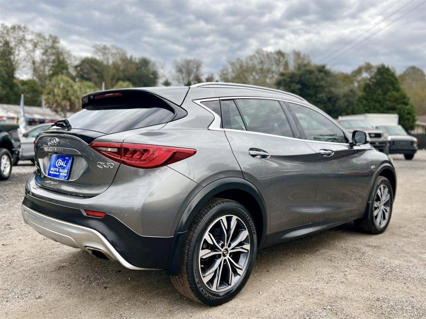 2017 Grey /Brown Infiniti QX30 (SJKCH5CR6HA) with an 2.0l I-4 DI Dohc T/C 2.0l engine, Automatic transmission, located at 745 East Steele Rd., West Columbia, SC, 29170, (803) 755-9148, 33.927212, -81.148483 - Special Internet Price! 2017 Infiniti QX30 with Bluetooth, AM/FM/CD/HD/SAT Audio System, Push Button Start, Remote Keyless Entry, Cruise Control, Dual Zone Front Automatic Air Conditioning, Panoramic Sunroof, Memory Driver Seat Settings, Powered Front Seats, Leather Interior, Rear 60-40 Folding Benc - Photo#2