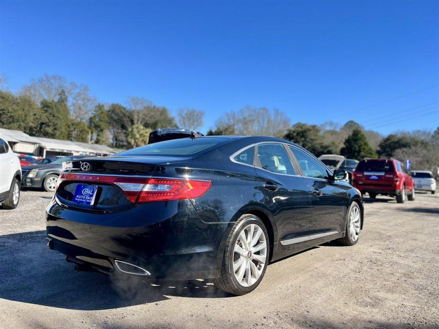 2012 Black /Tan Hyundai Azera (KMHFH4JG3CA) with an 3.3l V6 DI Dohc 3.3l engine, Automatic transmission, located at 745 East Steele Rd., West Columbia, SC, 29170, (803) 755-9148, 33.927212, -81.148483 - Special Internet Price! 2012 Hyundai Azera with Bluetooth, AM/FM/XM, Backup camera, Navigation, Cruise Control, Dual zone automatic climate control, Push button start, Panoramic sunroof, Heated seats in front and back, Powered windows, Powered door locks, Plus more! - Photo#2