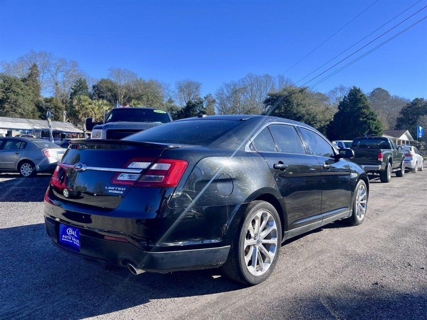 2014 Black /Black Ford Taurus (1FAHP2F87EG) with an 3.5l V6 Smpi TI-VCT 3.5l engine, Automatic transmission, located at 745 East Steele Rd., West Columbia, SC, 29170, (803) 755-9148, 33.927212, -81.148483 - Special Internet Price! 2014 Ford Taurus Limited with AM/FM Stereo/Single CD/MP3 Capable, Remote Keyless Entry, Cruise Control, Sunroof, Heated Seats, Powered Driver Seat, Push To Start, Power Windows, Powered Door Locks, Plus More! - Photo#2