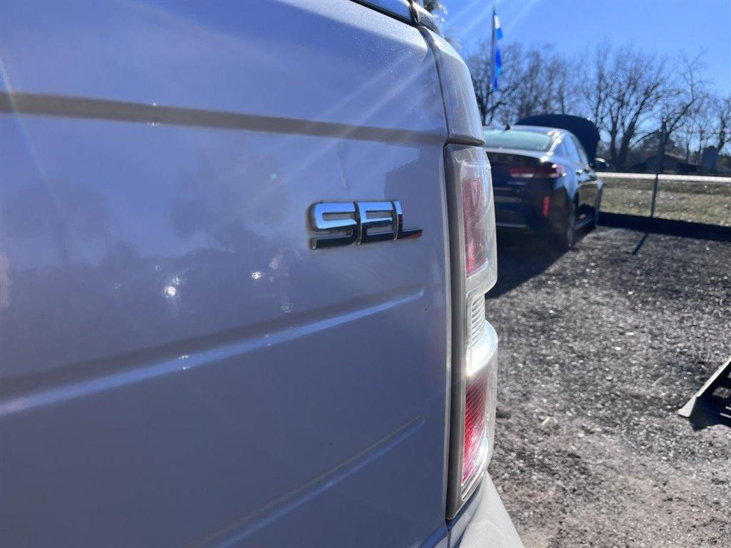 2011 White /Tan Ford Flex (2FMGK5CC6BB) with an 3.5l V6 SFI Dohc 24v 3.5l engine, Automatic transmission, located at 745 East Steele Rd., West Columbia, SC, 29170, (803) 755-9148, 33.927212, -81.148483 - Special Internet Price! 2011 Ford Flex SEL AM/FM stereo, Cruise control, Dual-zone air conditioning, Heated front leather bucket seats, 2nd row captain seats, Built in headrest DVD players, 3rd row bench seat, Powered liftgate, Sunroof, Powered windows, Powered door locks, Plus more! - Photo#32