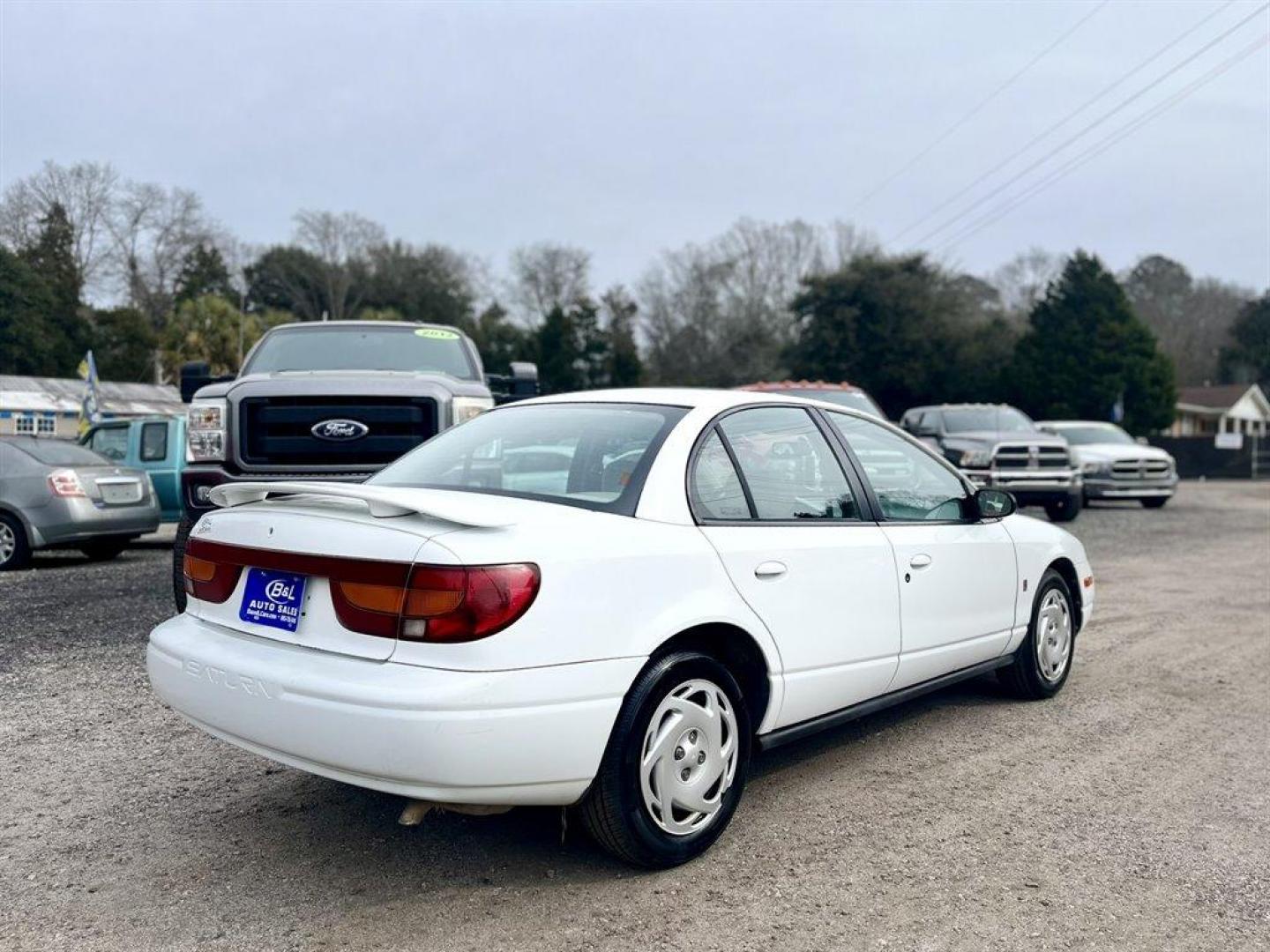 2001 White /Grey Saturn S-Series (1G8ZK52781Z) with an 1.9l I-4 SFI Dohc 1.9l engine, Automatic transmission, located at 745 East Steele Rd., West Columbia, SC, 29170, (803) 755-9148, 33.927212, -81.148483 - Special Internet Price! 2001 Saturn S-Series with AM/FM stereo, Air conditioning, Cruise control, Cloth seat upholstery, Rear 60/40 split fold-down, Powered windows, Powered door locks, Plus more! - Photo#2