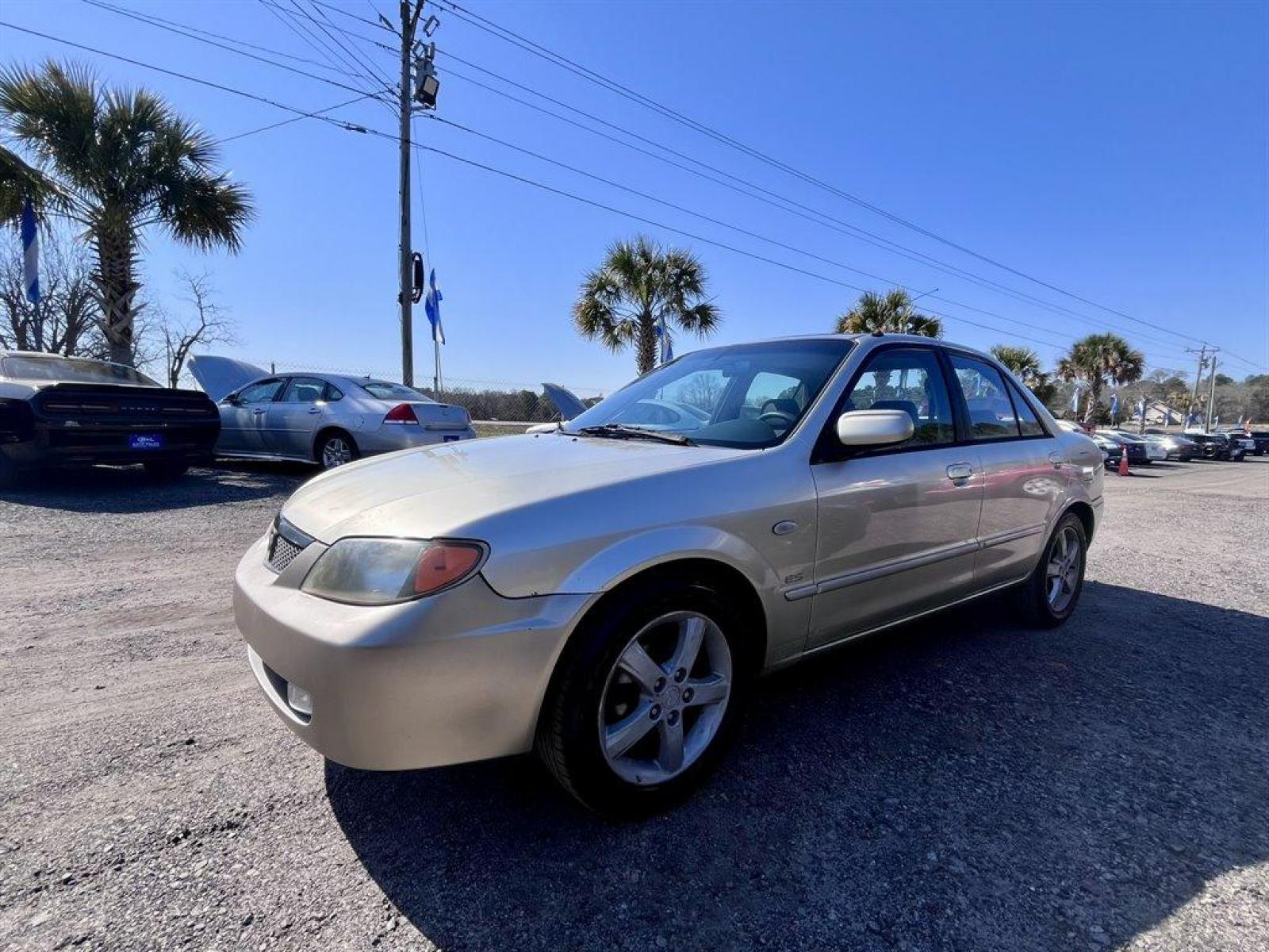 2002 Gold /Beige Mazda Protege (JM1BJ226021) with an 2.0l I-4 EFI Dohc 2.0l engine, 5 Speed Manual transmission, located at 745 East Steele Rd., West Columbia, SC, 29170, (803) 755-9148, 33.927212, -81.148483 - Special Internet Price! 2002 Mazda Protege with AM/FM stereo, Keyless remote, Air conditioning, Cruise control, Sunroof, Manual transmission, Cloth reclining front bucket seats, 60/40 split fold-down rear, Powered windows, Plus more! - Photo #0