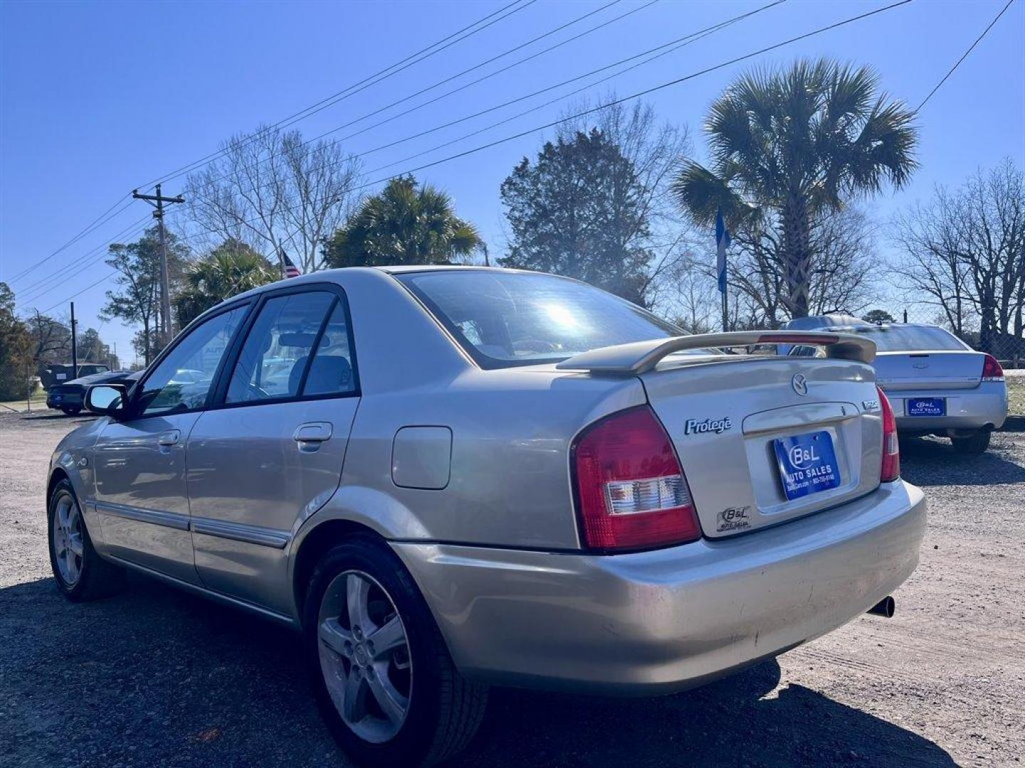 2002 Gold /Beige Mazda Protege (JM1BJ226021) with an 2.0l I-4 EFI Dohc 2.0l engine, 5 Speed Manual transmission, located at 745 East Steele Rd., West Columbia, SC, 29170, (803) 755-9148, 33.927212, -81.148483 - Special Internet Price! 2002 Mazda Protege with AM/FM stereo, Keyless remote, Air conditioning, Cruise control, Sunroof, Manual transmission, Cloth reclining front bucket seats, 60/40 split fold-down rear, Powered windows, Plus more! - Photo#1