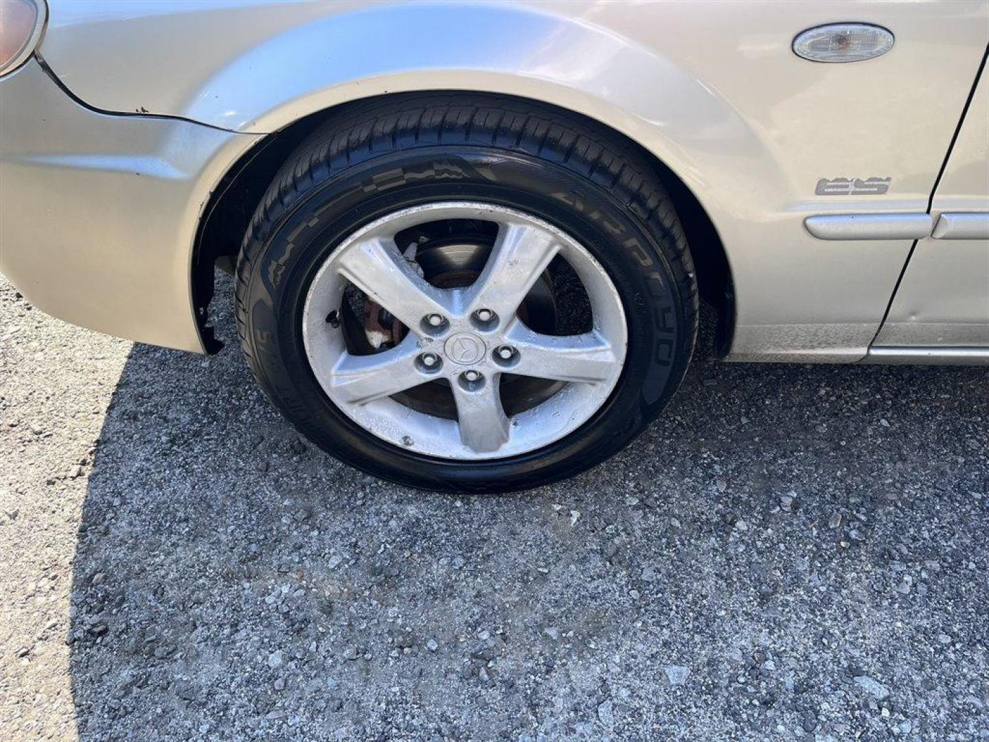 2002 Gold /Beige Mazda Protege (JM1BJ226021) with an 2.0l I-4 EFI Dohc 2.0l engine, 5 Speed Manual transmission, located at 745 East Steele Rd., West Columbia, SC, 29170, (803) 755-9148, 33.927212, -81.148483 - Special Internet Price! 2002 Mazda Protege with AM/FM stereo, Keyless remote, Air conditioning, Cruise control, Sunroof, Manual transmission, Cloth reclining front bucket seats, 60/40 split fold-down rear, Powered windows, Plus more! - Photo#30