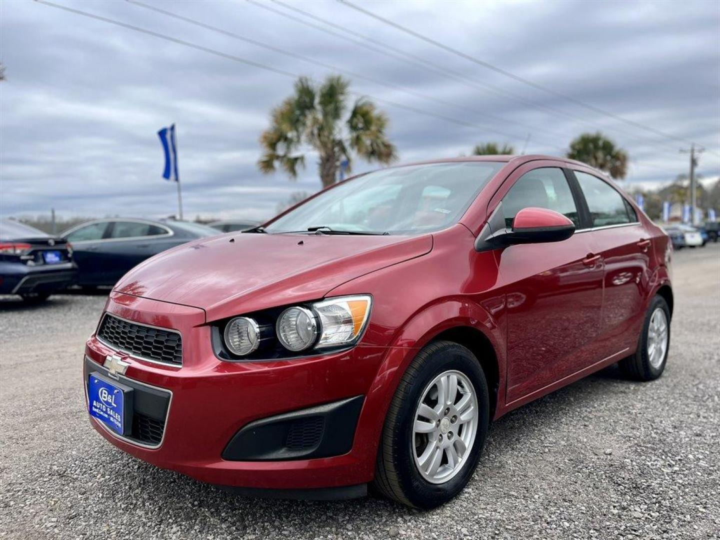 2013 Red /Black Chevrolet Sonic (1G1JD5SB7D4) with an 1.4l I-4 MFI Dohc T/C 1.4 engine, Manual transmission, located at 745 East Steele Rd., West Columbia, SC, 29170, (803) 755-9148, 33.927212, -81.148483 - Special Internet Price! 2013 Chevrolet Sonic LT with Bluetooth, Sirius XM Satellite Radio, Cruise control, Air conditioning, Remote keyless entry, Cloth interior, Powered windows, Powered door locks, Plus more! - Photo#0