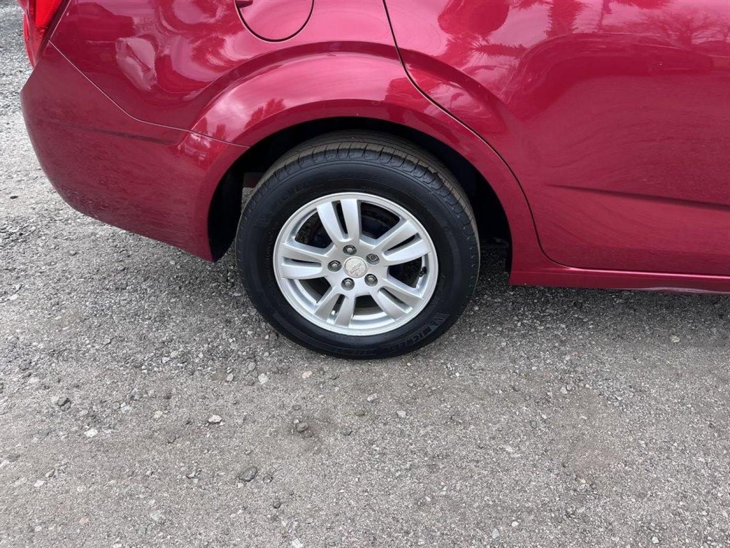 2013 Red /Black Chevrolet Sonic (1G1JD5SB7D4) with an 1.4l I-4 MFI Dohc T/C 1.4 engine, Manual transmission, located at 745 East Steele Rd., West Columbia, SC, 29170, (803) 755-9148, 33.927212, -81.148483 - Special Internet Price! 2013 Chevrolet Sonic LT with Bluetooth, Sirius XM Satellite Radio, Cruise control, Air conditioning, Remote keyless entry, Cloth interior, Powered windows, Powered door locks, Plus more! - Photo#26