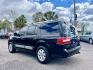 2008 Black /Tan Lincoln Navigator (5LMFU27598L) with an 5.4l V8 EFI Sohc 3v 5.4l engine, Automatic transmission, located at 745 East Steele Rd., West Columbia, SC, 29170, (803) 755-9148, 33.927212, -81.148483 - Special Internet Price! 2008 Lincoln Navigator Luxury with AM/FM stereo, Remote keyless entry, Leather seating surfaces, Cruise control, Sunroof, Rear entertainment, 2nd row center console, Powered 3rd row folding seats, Powered windows, Powered door locks, Plus more! - Photo#1