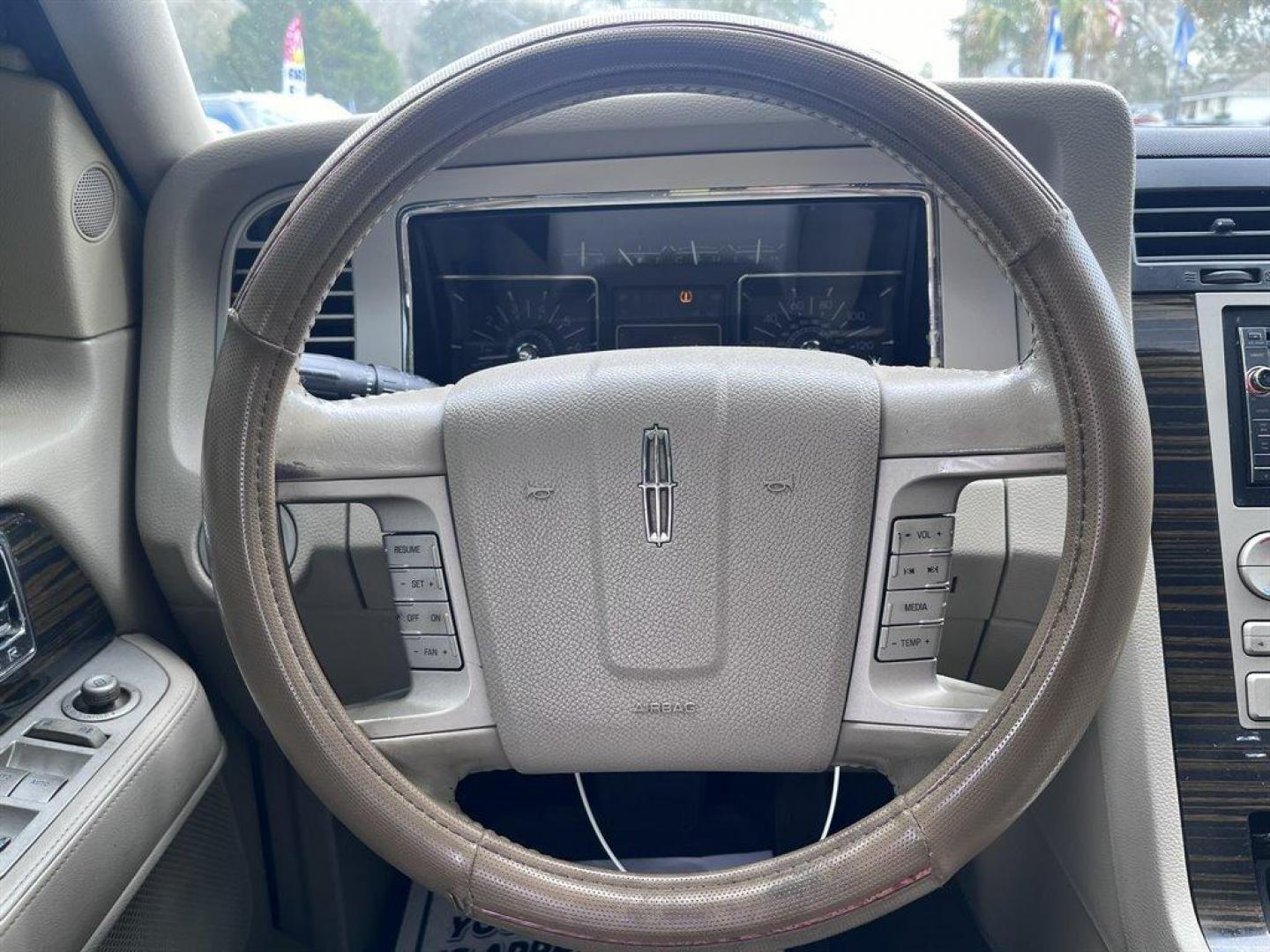 2008 Black /Tan Lincoln Navigator (5LMFU27598L) with an 5.4l V8 EFI Sohc 3v 5.4l engine, Automatic transmission, located at 745 East Steele Rd., West Columbia, SC, 29170, (803) 755-9148, 33.927212, -81.148483 - Special Internet Price! 2008 Lincoln Navigator Luxury with AM/FM stereo, Remote keyless entry, Leather seating surfaces, Cruise control, Sunroof, Rear entertainment, 2nd row center console, Powered 3rd row folding seats, Powered windows, Powered door locks, Plus more! - Photo#5