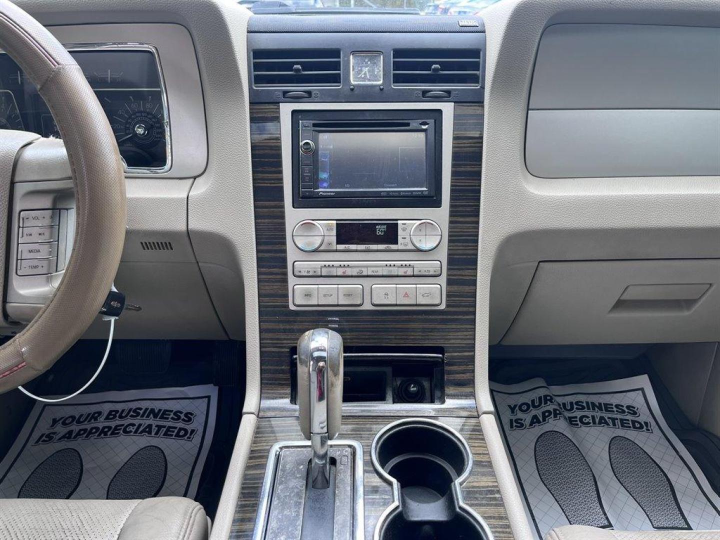 2008 Black /Tan Lincoln Navigator (5LMFU27598L) with an 5.4l V8 EFI Sohc 3v 5.4l engine, Automatic transmission, located at 745 East Steele Rd., West Columbia, SC, 29170, (803) 755-9148, 33.927212, -81.148483 - Special Internet Price! 2008 Lincoln Navigator Luxury with AM/FM stereo, Remote keyless entry, Leather seating surfaces, Cruise control, Sunroof, Rear entertainment, 2nd row center console, Powered 3rd row folding seats, Powered windows, Powered door locks, Plus more! - Photo#8