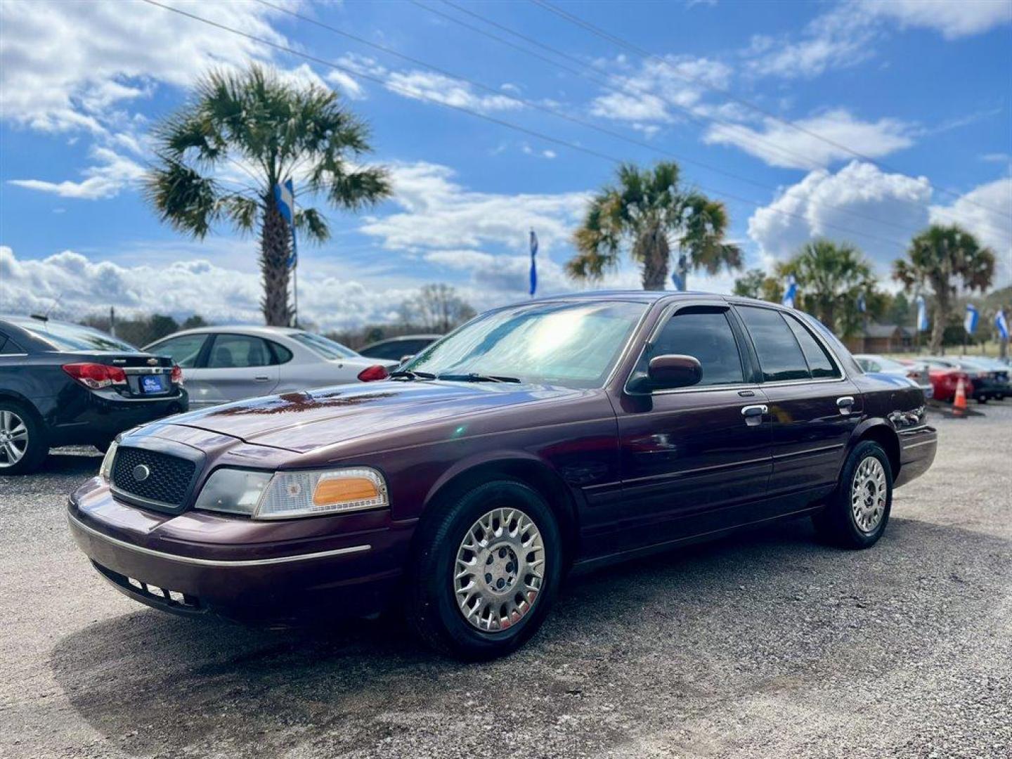 2003 Burgundy /Tan Ford Crown Victoria (2FAFP74W53X) with an 4.6l V8 EFI Sohc 4.6l engine, Automatic transmission, located at 745 East Steele Rd., West Columbia, SC, 29170, (803) 755-9148, 33.927212, -81.148483 - Special Internet Price! 2003 Ford Crown Victoria LX with AM/FM stereo radio, Air conditioning, Split-bench front seat, Leather interior, Powered windows, Powered door locks, Plus more! - Photo#0