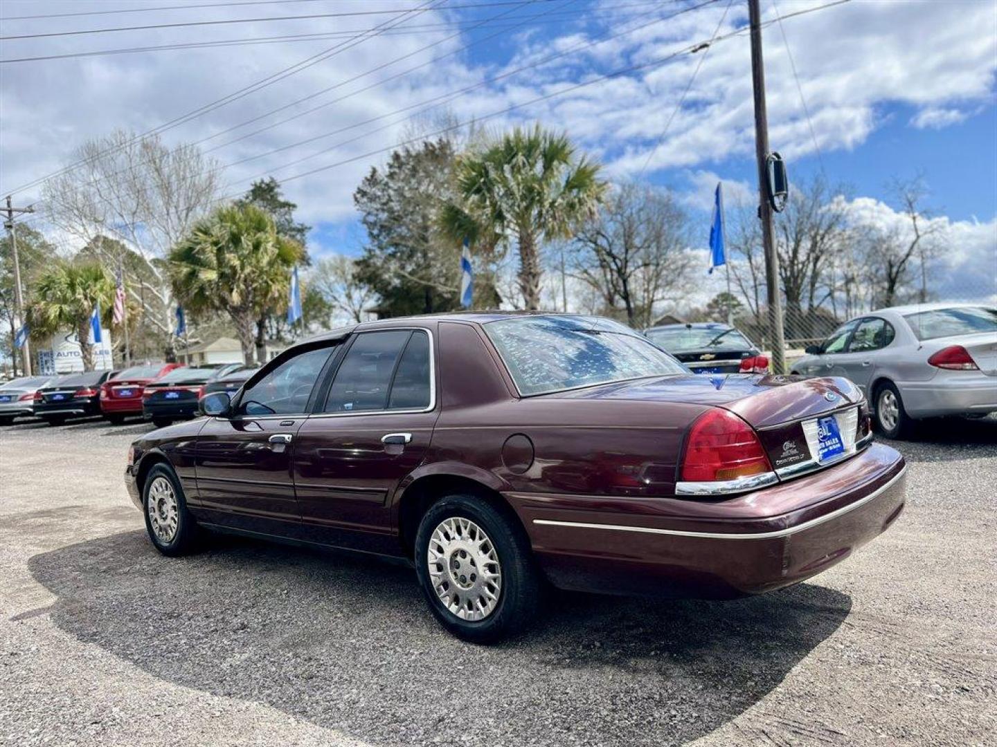 2003 Burgundy /Tan Ford Crown Victoria (2FAFP74W53X) with an 4.6l V8 EFI Sohc 4.6l engine, Automatic transmission, located at 745 East Steele Rd., West Columbia, SC, 29170, (803) 755-9148, 33.927212, -81.148483 - Special Internet Price! 2003 Ford Crown Victoria LX with AM/FM stereo radio, Air conditioning, Split-bench front seat, Leather interior, Powered windows, Powered door locks, Plus more! - Photo#1