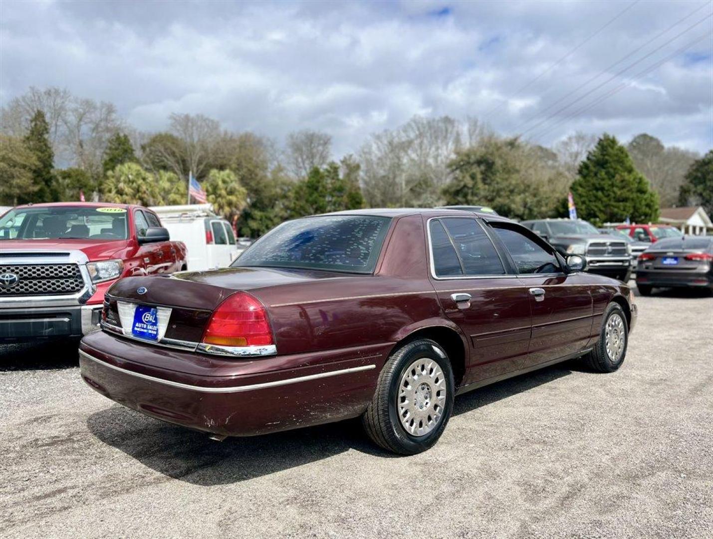 2003 Burgundy /Tan Ford Crown Victoria (2FAFP74W53X) with an 4.6l V8 EFI Sohc 4.6l engine, Automatic transmission, located at 745 East Steele Rd., West Columbia, SC, 29170, (803) 755-9148, 33.927212, -81.148483 - Special Internet Price! 2003 Ford Crown Victoria LX with AM/FM stereo radio, Air conditioning, Split-bench front seat, Leather interior, Powered windows, Powered door locks, Plus more! - Photo#2