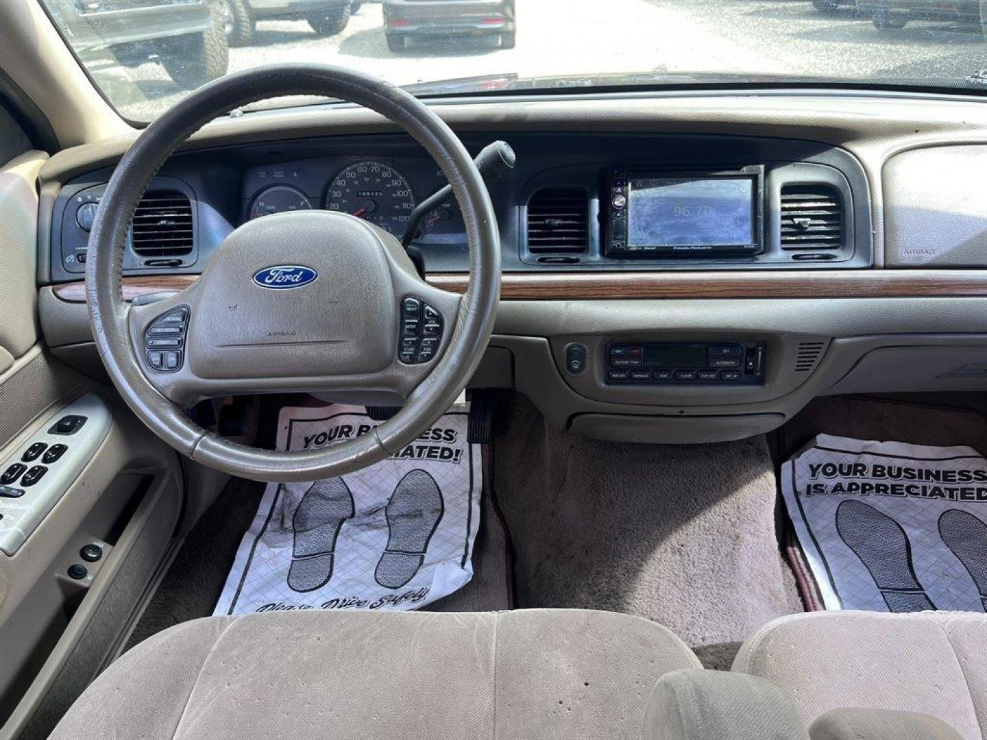 2003 Burgundy /Tan Ford Crown Victoria (2FAFP74W53X) with an 4.6l V8 EFI Sohc 4.6l engine, Automatic transmission, located at 745 East Steele Rd., West Columbia, SC, 29170, (803) 755-9148, 33.927212, -81.148483 - Special Internet Price! 2003 Ford Crown Victoria LX with AM/FM stereo radio, Air conditioning, Split-bench front seat, Leather interior, Powered windows, Powered door locks, Plus more! - Photo#4