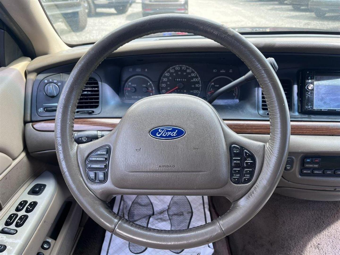 2003 Burgundy /Tan Ford Crown Victoria (2FAFP74W53X) with an 4.6l V8 EFI Sohc 4.6l engine, Automatic transmission, located at 745 East Steele Rd., West Columbia, SC, 29170, (803) 755-9148, 33.927212, -81.148483 - Special Internet Price! 2003 Ford Crown Victoria LX with AM/FM stereo radio, Air conditioning, Split-bench front seat, Leather interior, Powered windows, Powered door locks, Plus more! - Photo#5