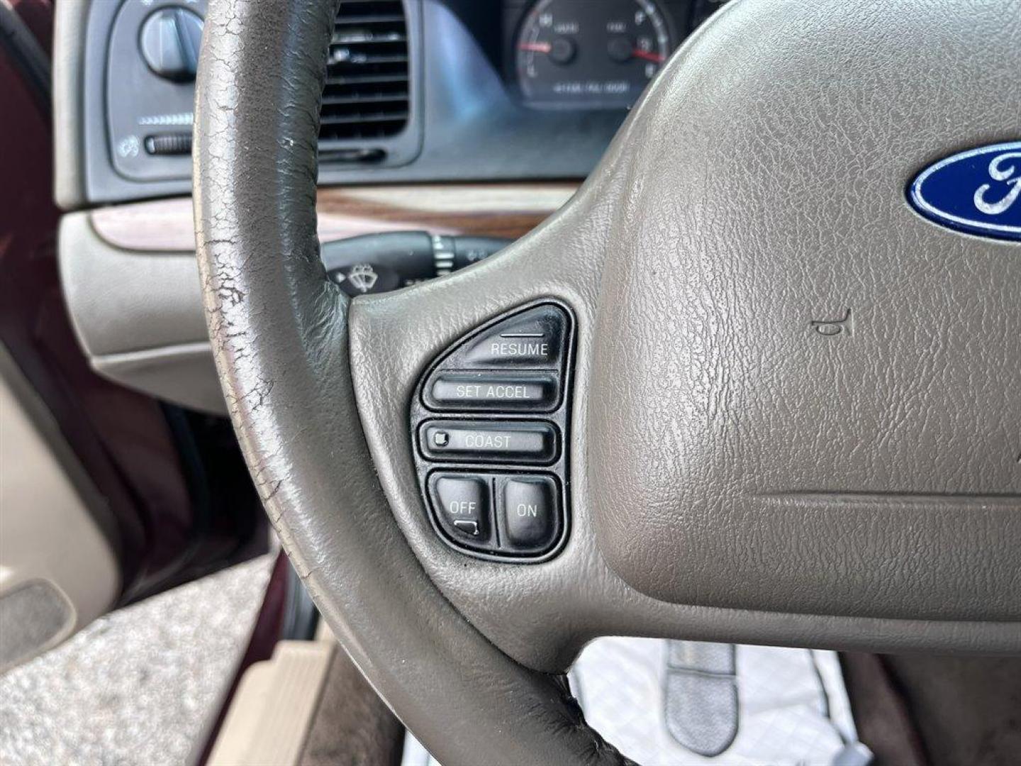 2003 Burgundy /Tan Ford Crown Victoria (2FAFP74W53X) with an 4.6l V8 EFI Sohc 4.6l engine, Automatic transmission, located at 745 East Steele Rd., West Columbia, SC, 29170, (803) 755-9148, 33.927212, -81.148483 - Special Internet Price! 2003 Ford Crown Victoria LX with AM/FM stereo radio, Air conditioning, Split-bench front seat, Leather interior, Powered windows, Powered door locks, Plus more! - Photo#6