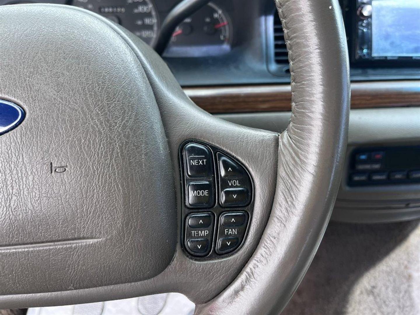 2003 Burgundy /Tan Ford Crown Victoria (2FAFP74W53X) with an 4.6l V8 EFI Sohc 4.6l engine, Automatic transmission, located at 745 East Steele Rd., West Columbia, SC, 29170, (803) 755-9148, 33.927212, -81.148483 - Special Internet Price! 2003 Ford Crown Victoria LX with AM/FM stereo radio, Air conditioning, Split-bench front seat, Leather interior, Powered windows, Powered door locks, Plus more! - Photo#7