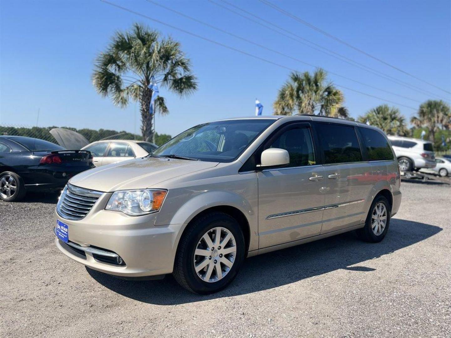 2016 Gold /Black Chrysler Town and Country (2C4RC1BGXGR) with an 3.6l V6 MPI Dohc VVT Flex engine, Automatic transmission, located at 745 East Steele Rd., West Columbia, SC, 29170, (803) 755-9148, 33.927212, -81.148483 - Special Internet Price! 2016 Chrysler Town and Country Touring with Bluetooth, Backup camera, Cruise control, Air conditioning, Leather interior, Rear entertainment, 3rd row seating, Powered sliding rear doors, Powered liftgate, Powered driver seat, Powered windows, Powered door locks, Plus more! - Photo#0