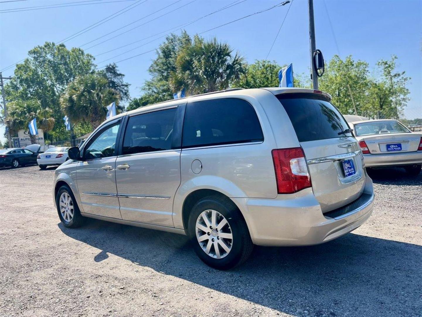 2016 Gold /Black Chrysler Town and Country (2C4RC1BGXGR) with an 3.6l V6 MPI Dohc VVT Flex engine, Automatic transmission, located at 745 East Steele Rd., West Columbia, SC, 29170, (803) 755-9148, 33.927212, -81.148483 - Special Internet Price! 2016 Chrysler Town and Country Touring with Bluetooth, Backup camera, Cruise control, Air conditioning, Leather interior, Rear entertainment, 3rd row seating, Powered sliding rear doors, Powered liftgate, Powered driver seat, Powered windows, Powered door locks, Plus more! - Photo#1