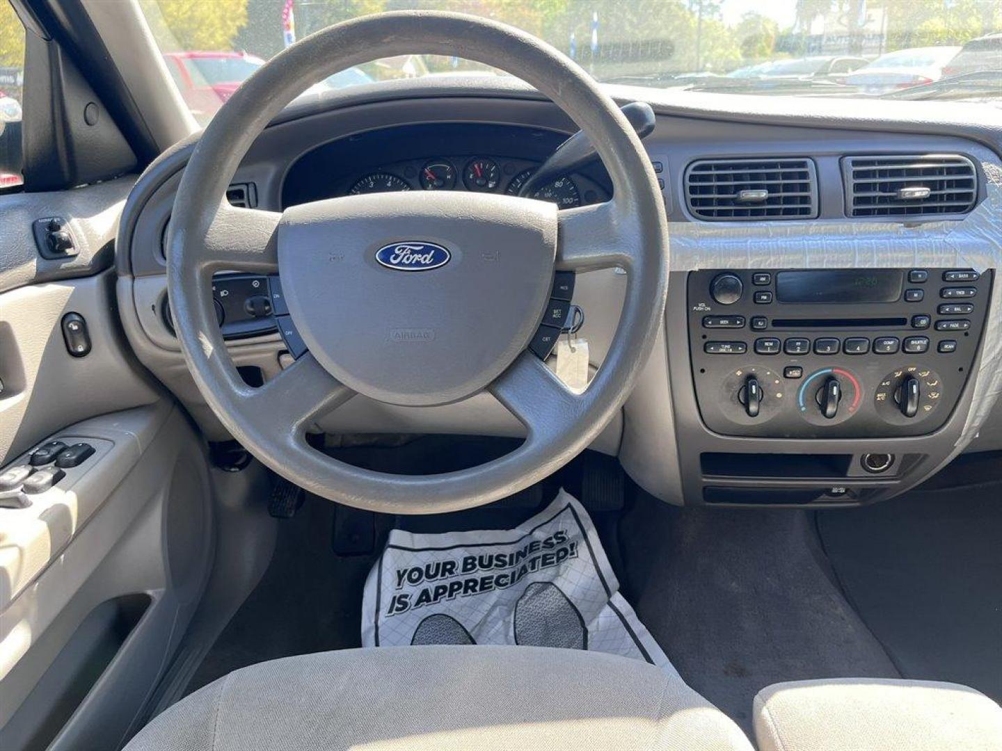 2007 Blue /Tan Ford Taurus (1FAFP53U57A) with an 3.0l V6 SFI 3.0l engine, Automatic transmission, located at 745 East Steele Rd., West Columbia, SC, 29170, (803) 755-9148, 33.927212, -81.148483 - CASH CAR! AS IS! AS IS! AS IS! - Photo#4