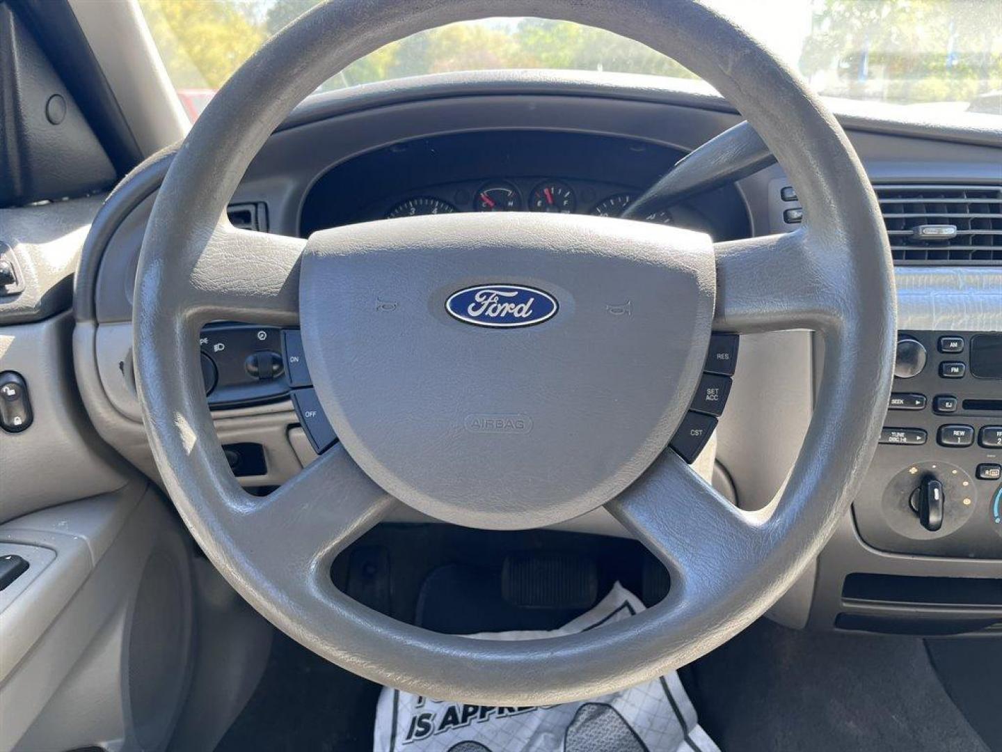 2007 Blue /Tan Ford Taurus (1FAFP53U57A) with an 3.0l V6 SFI 3.0l engine, Automatic transmission, located at 745 East Steele Rd., West Columbia, SC, 29170, (803) 755-9148, 33.927212, -81.148483 - CASH CAR! AS IS! AS IS! AS IS! - Photo#5